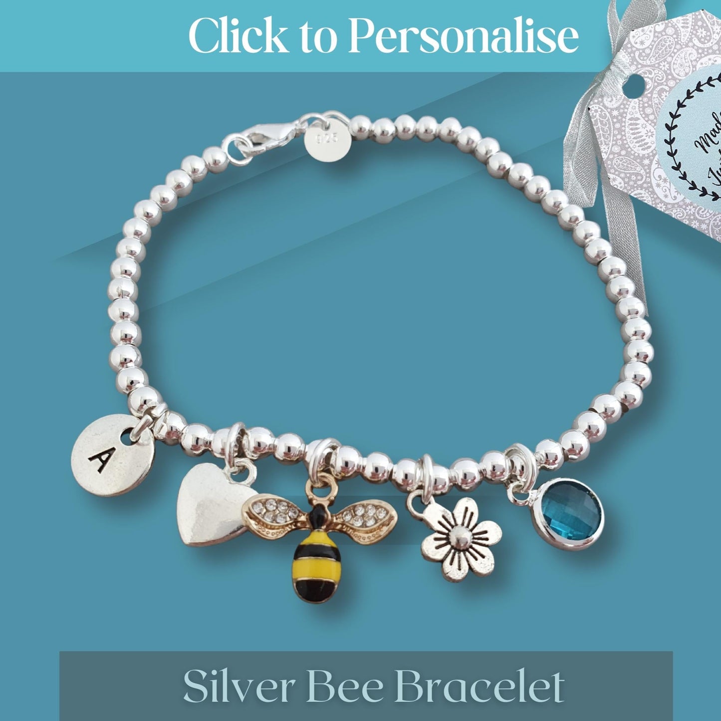 Silver bee bracelet with charms on a blue background