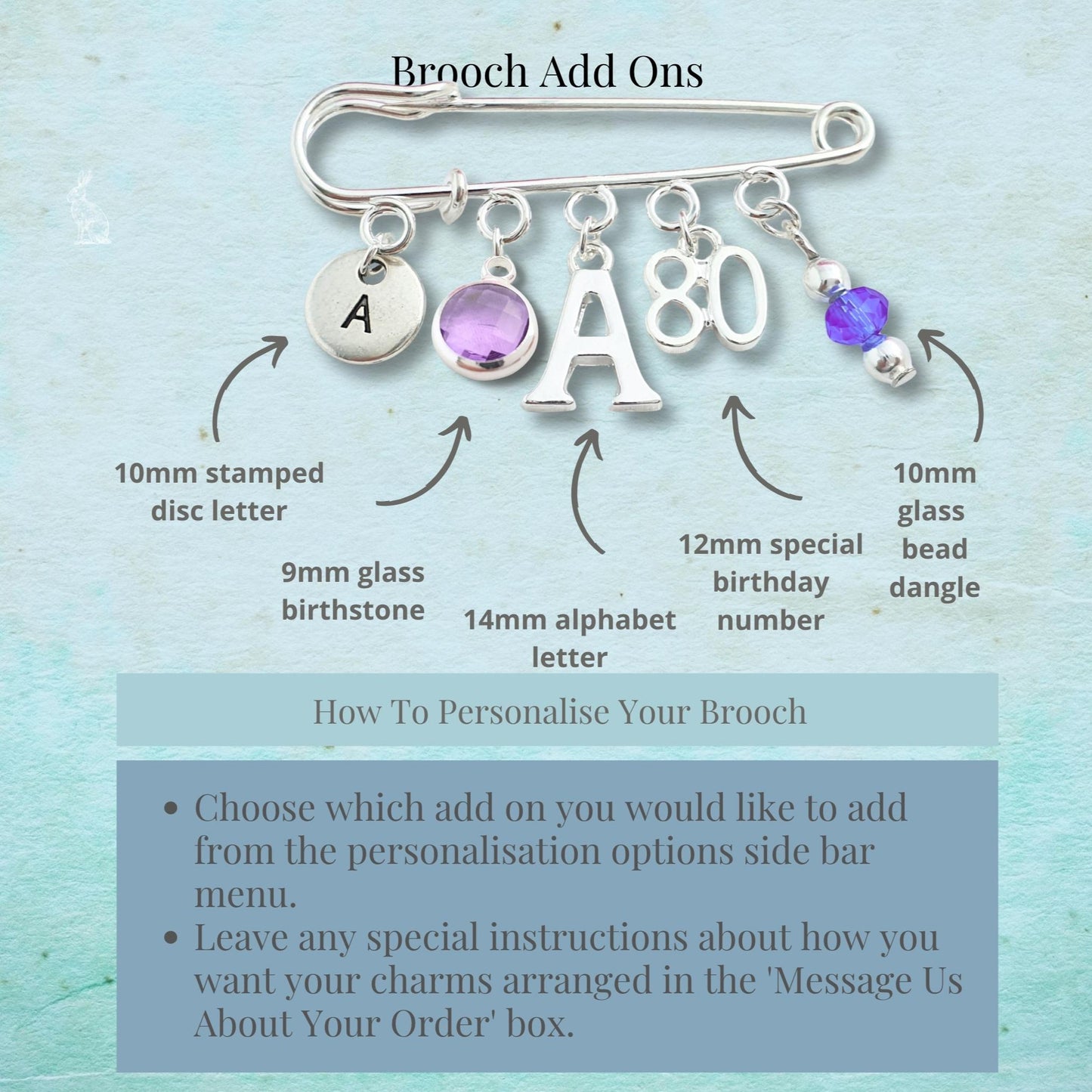 Brooch with customizable add-ons on a light blue background