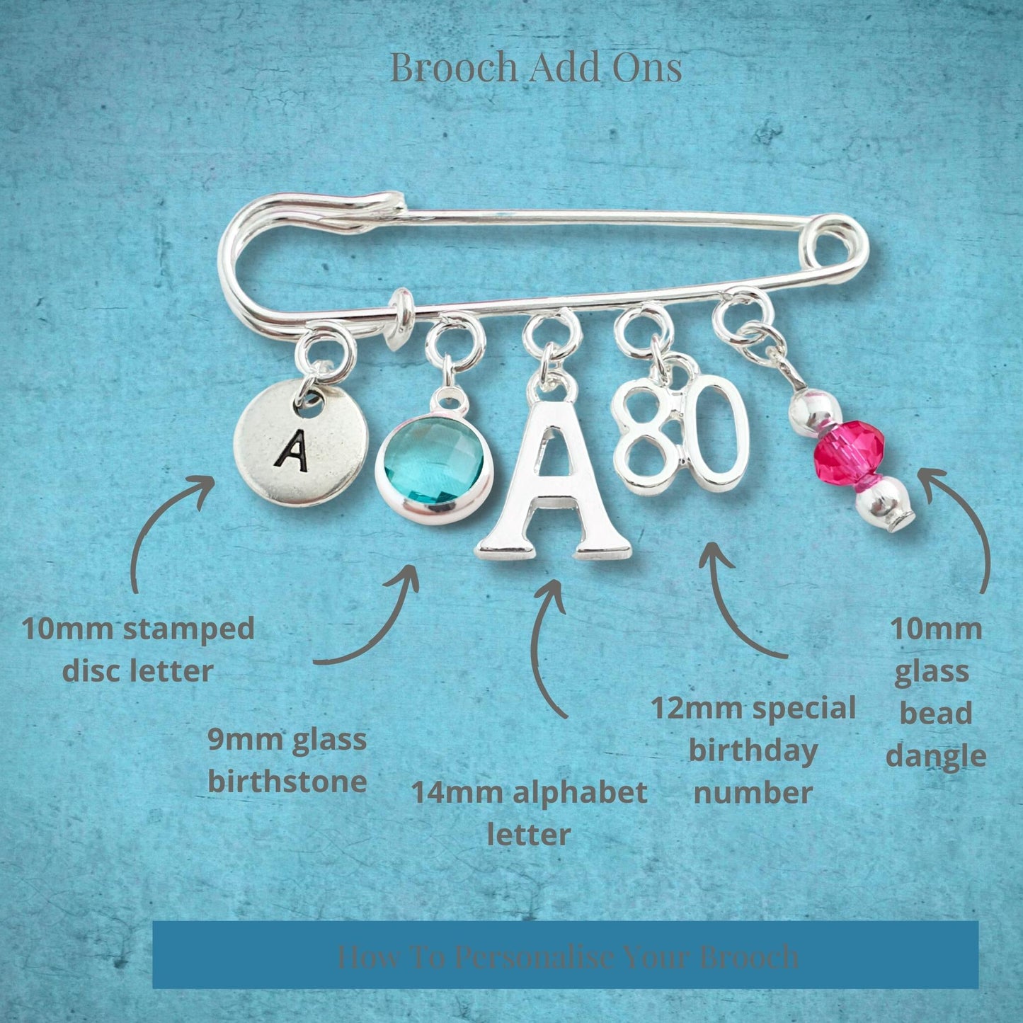 Brooch with customizable add-ons on a textured blue background
