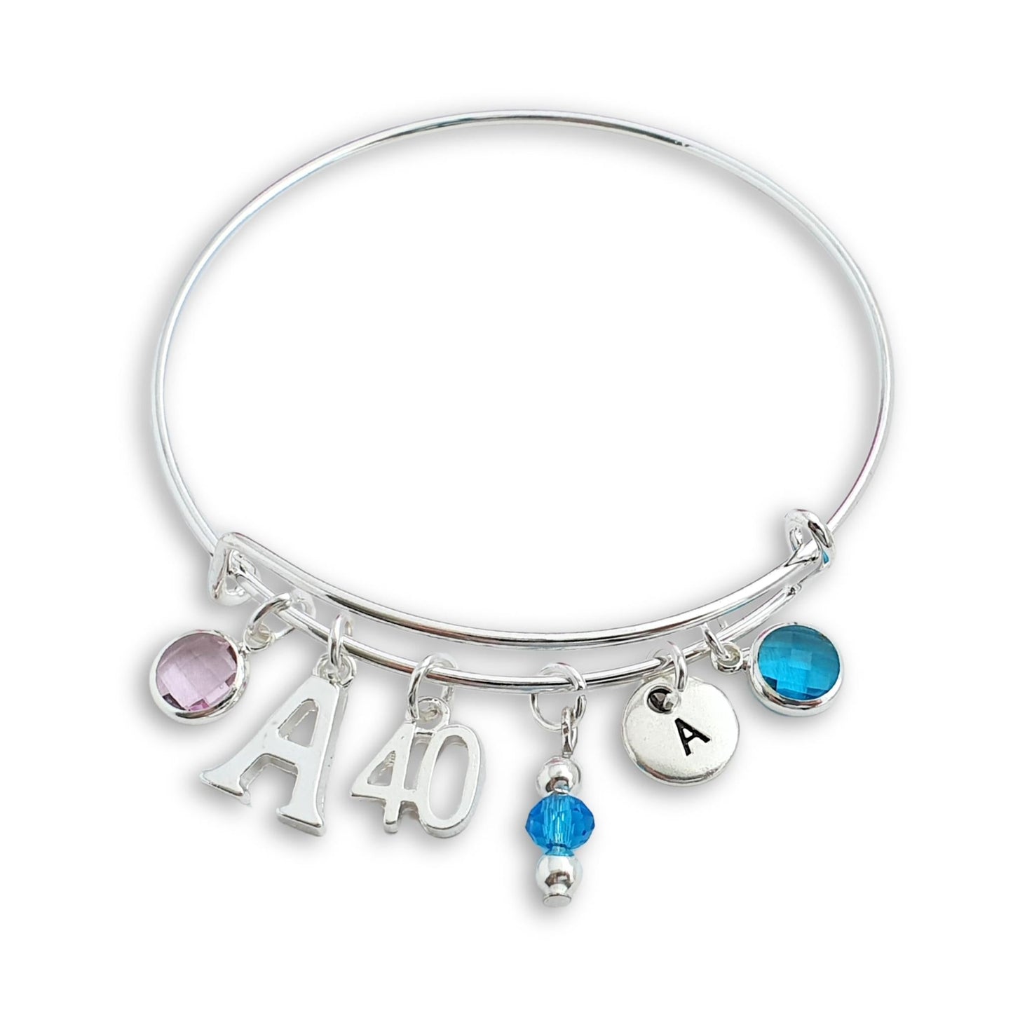 Silver bangle with charms including letters and numbers on a white background