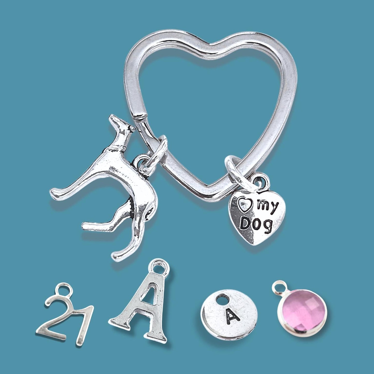 Silver keychain with various charms on a blue background