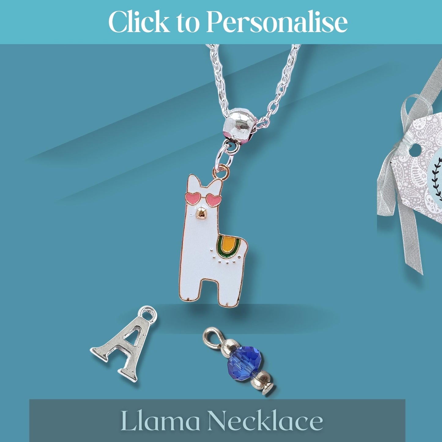 Llama necklace with detachable letter 'A' and blue gem charm on a teal background.