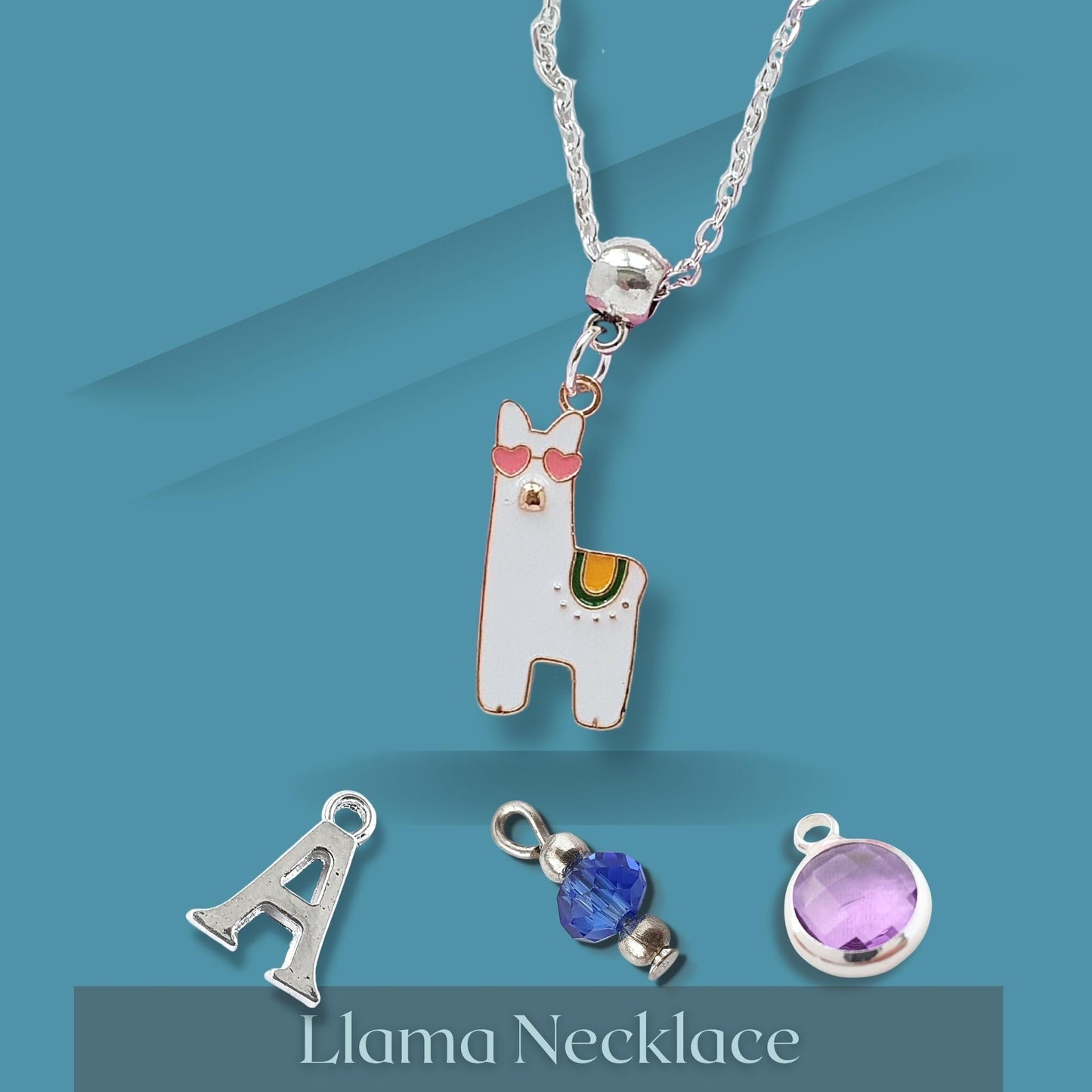 Llama necklace with detachable charms on a blue background