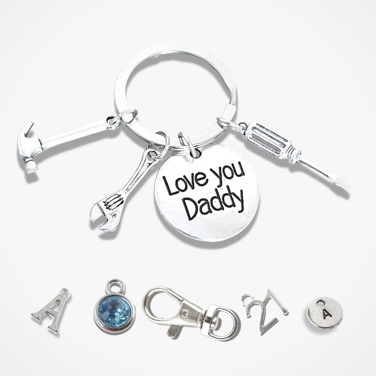 love you daddy keyring with hammer, wrench and screw driver charms attached and optional initial charms, birthstone charms, special birthday number charms and bag clasp