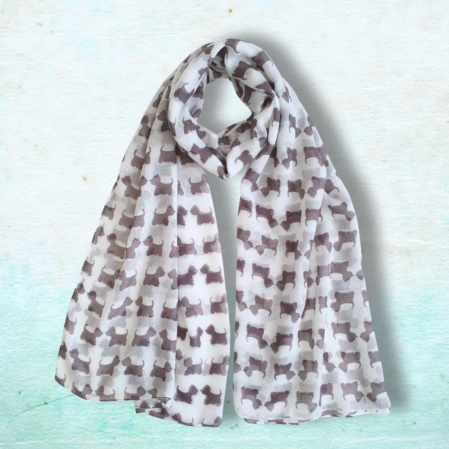 Scarf with westie dog pattern on a light blue background