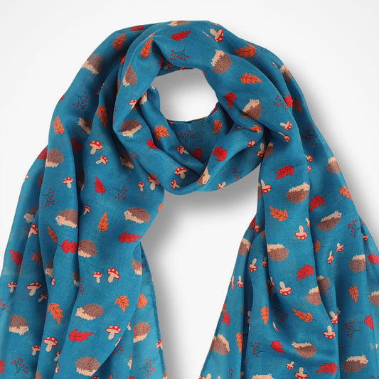 Teal scarf with hedgehog pattern on a white background
