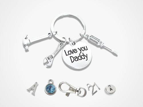 love you daddy keyring with hammer, wrench and screw driver charms attached and optional initial charms, birthstone charms, special birthday number charms and bag clasp