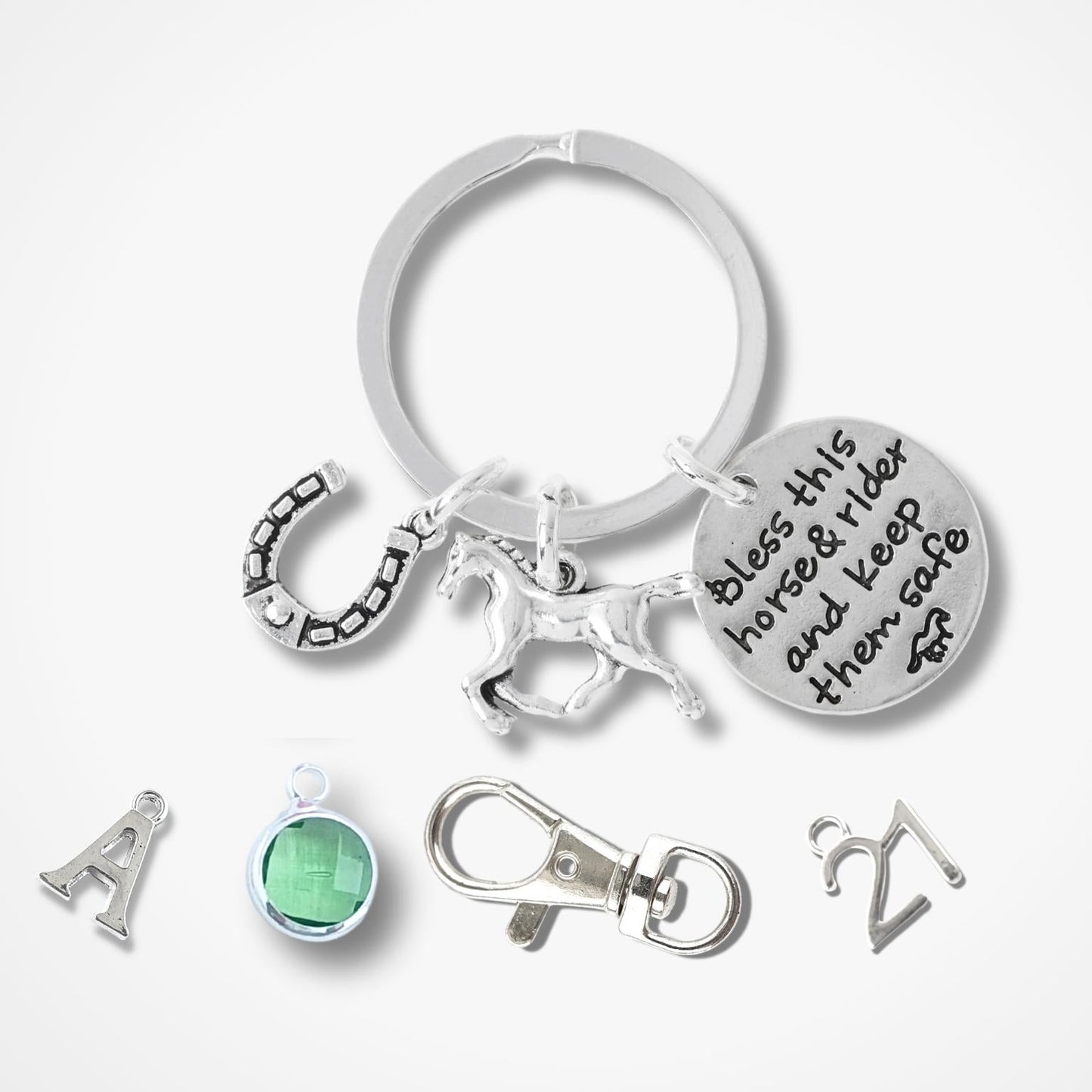 Silver keychain with various charms on a white background