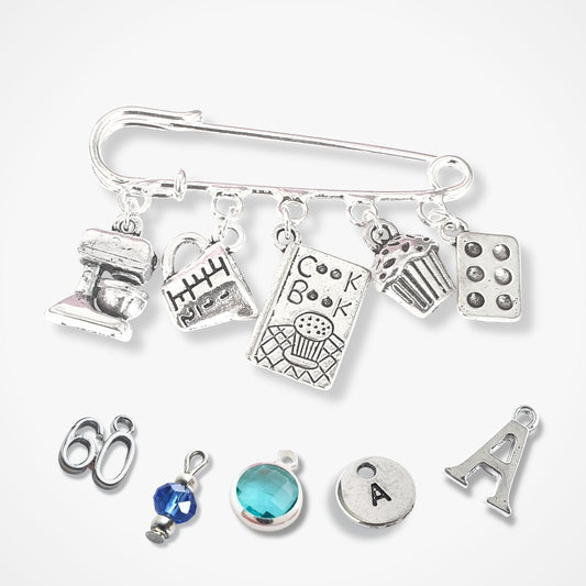 Silver charm bracelet with various charms on a white background