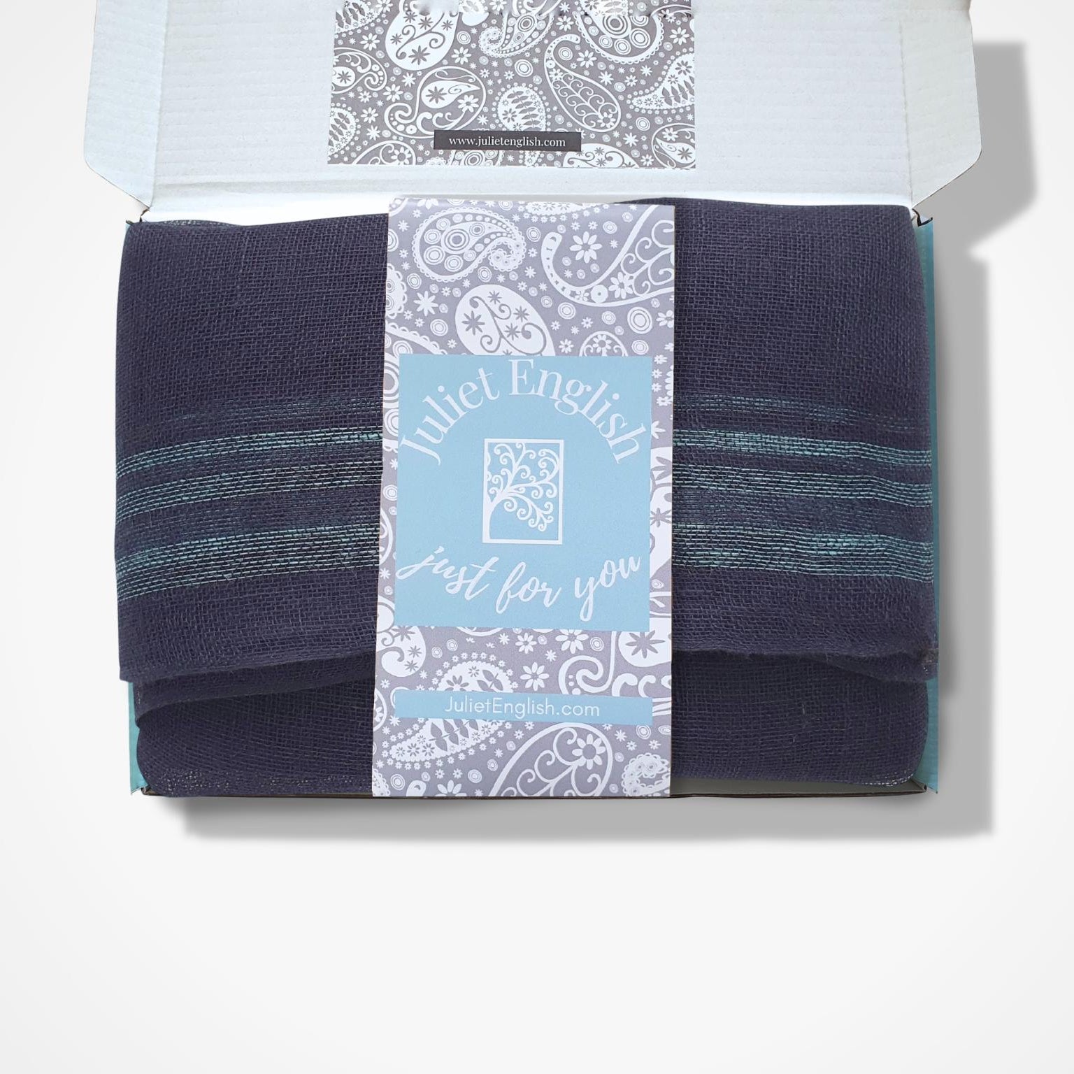 navy scarf in a box with a Juliet English  label on a white background