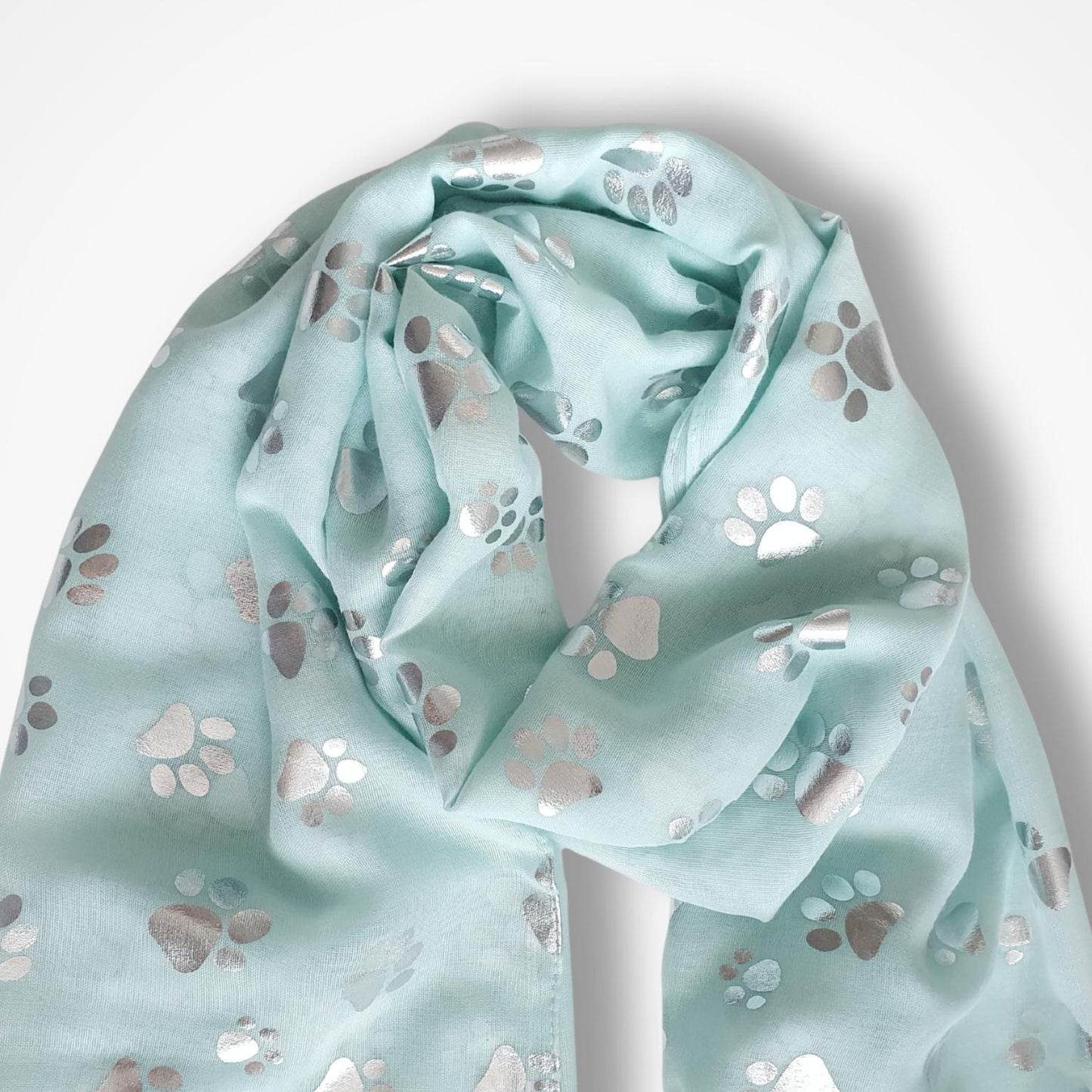Light aqua scarf with paw print pattern on a white background