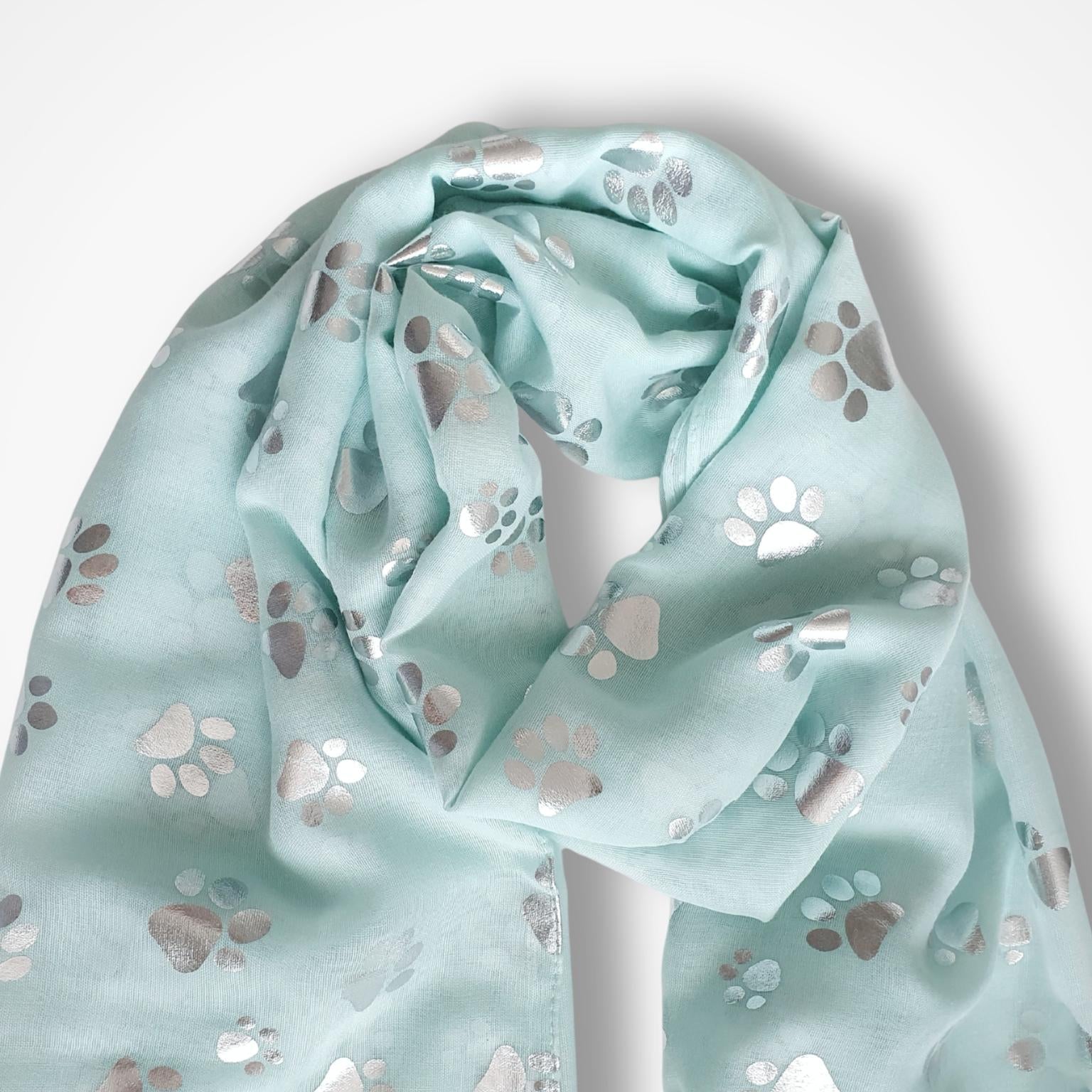 Light aqua scarf with paw print pattern on a white background
