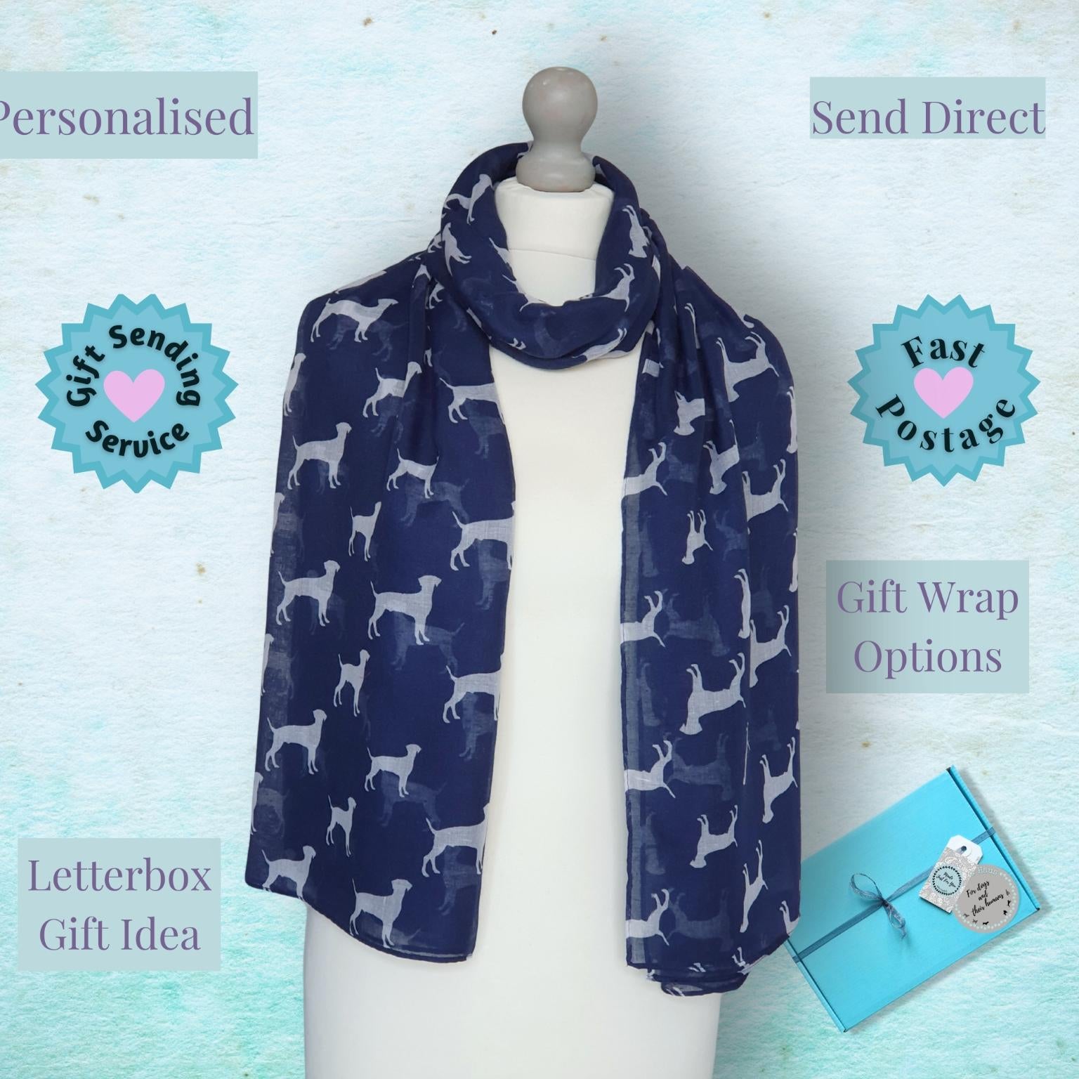 Navy blue scarf with white dog pattern on a mannequin against a light blue background with promotional text.