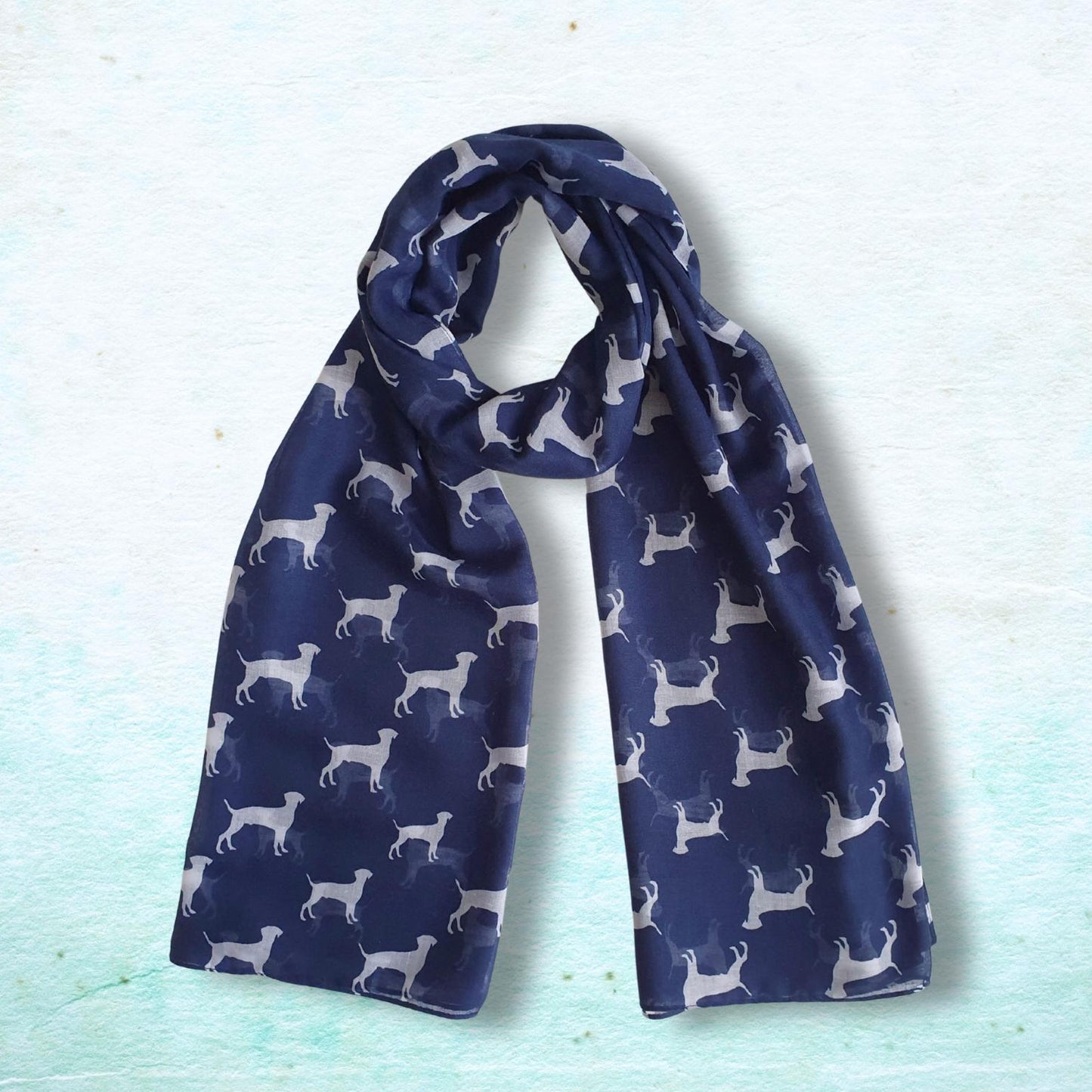 Navy blue scarf with white dog pattern on a light blue background