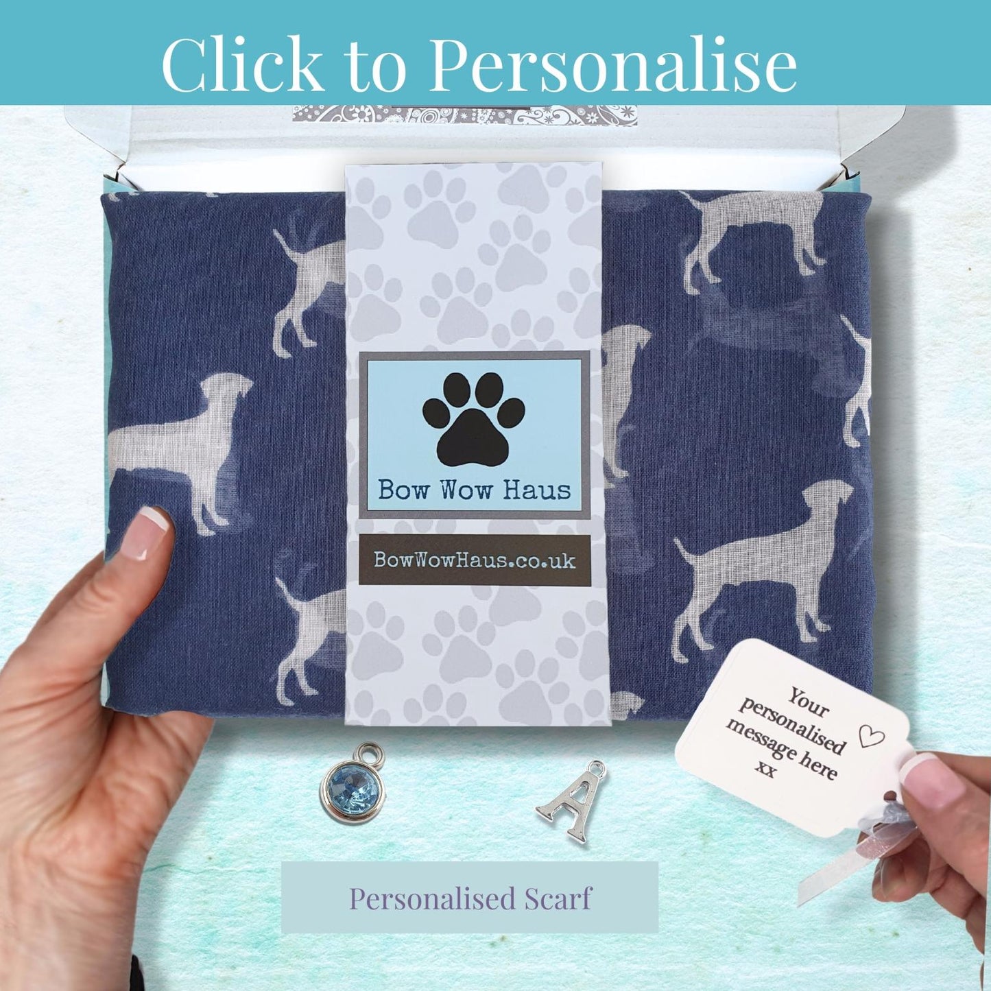 Personalized scarf with paw print design held by a hand, with 'Bow Wow Haus' branding.