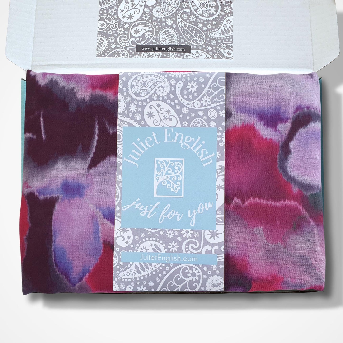 floral scarf in Juliet English product packaging with floral design and brand name on a white background