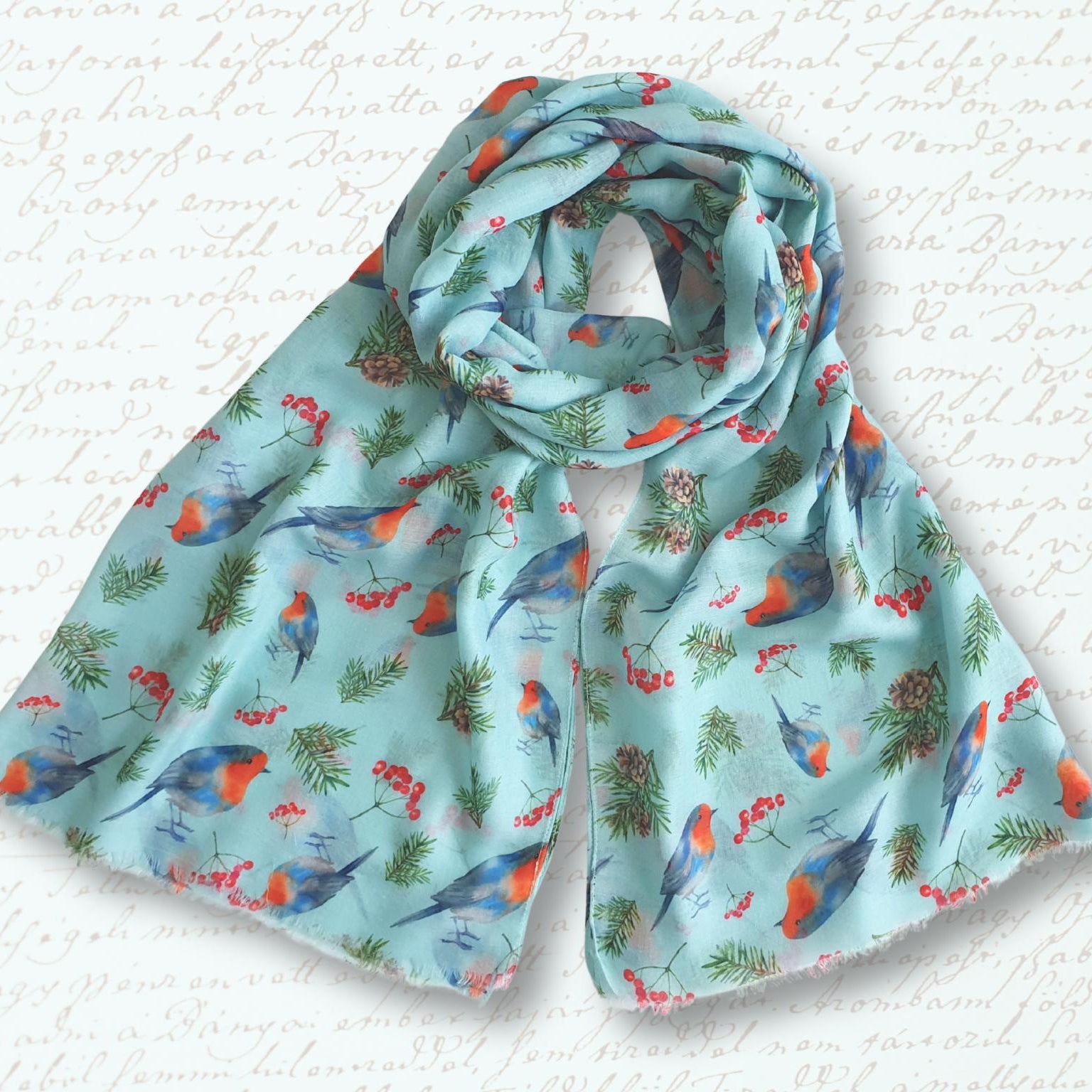 Scarf with robin pattern on a textured white background