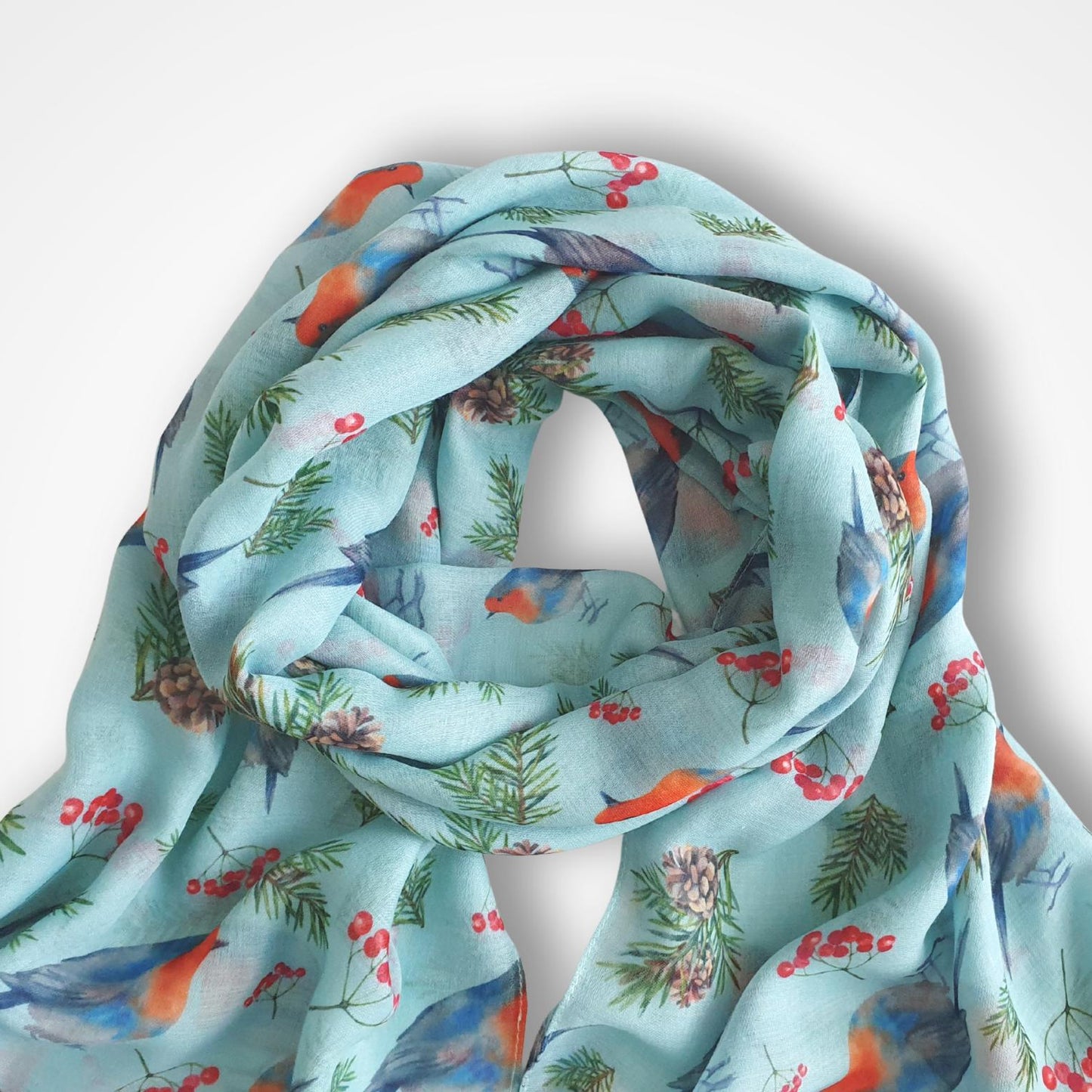Scarf with robin and berries pattern on a light aqua background
