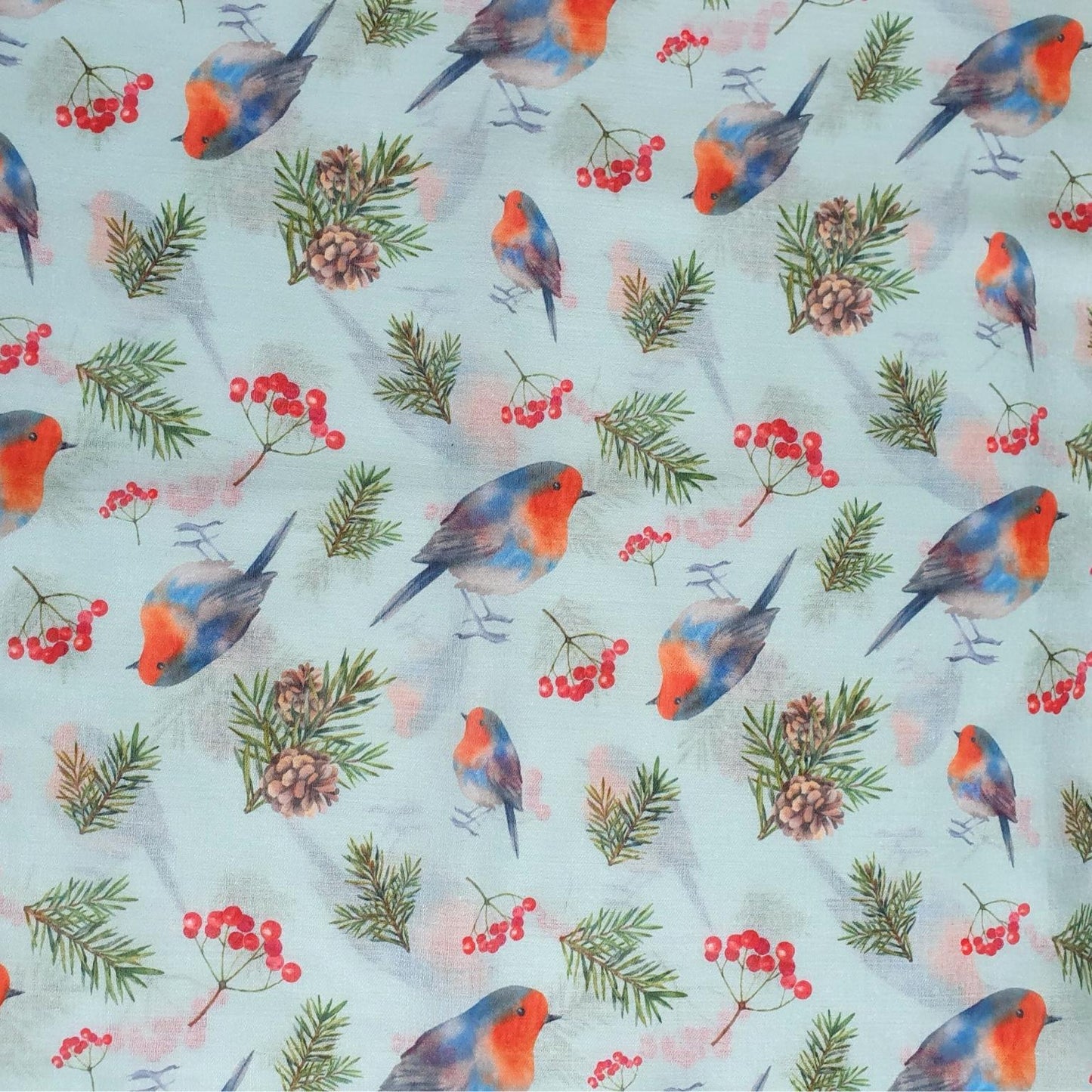 Pattern of colourful robins and berries on a light blue background