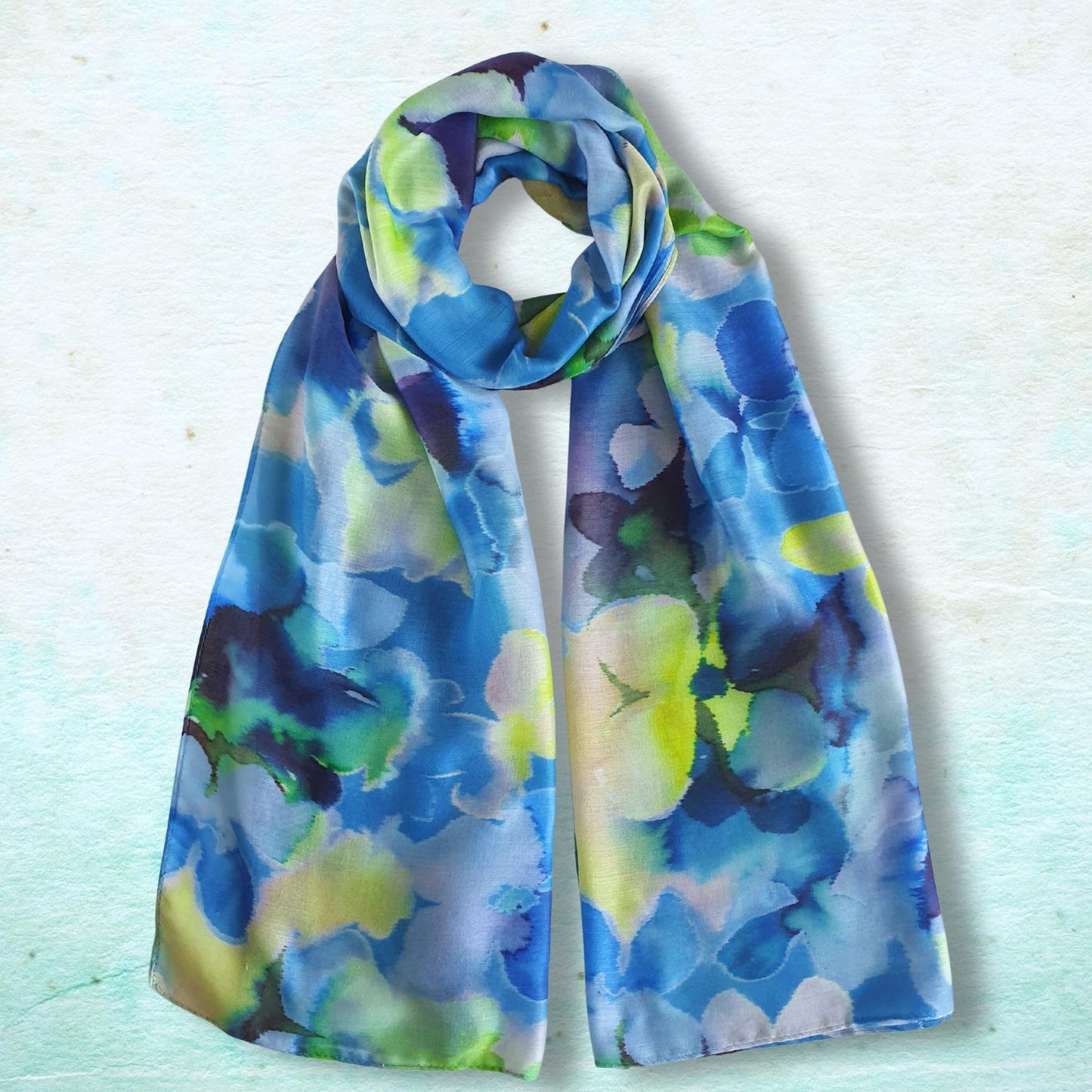 Colorful floral-patterned scarf on a light blue background