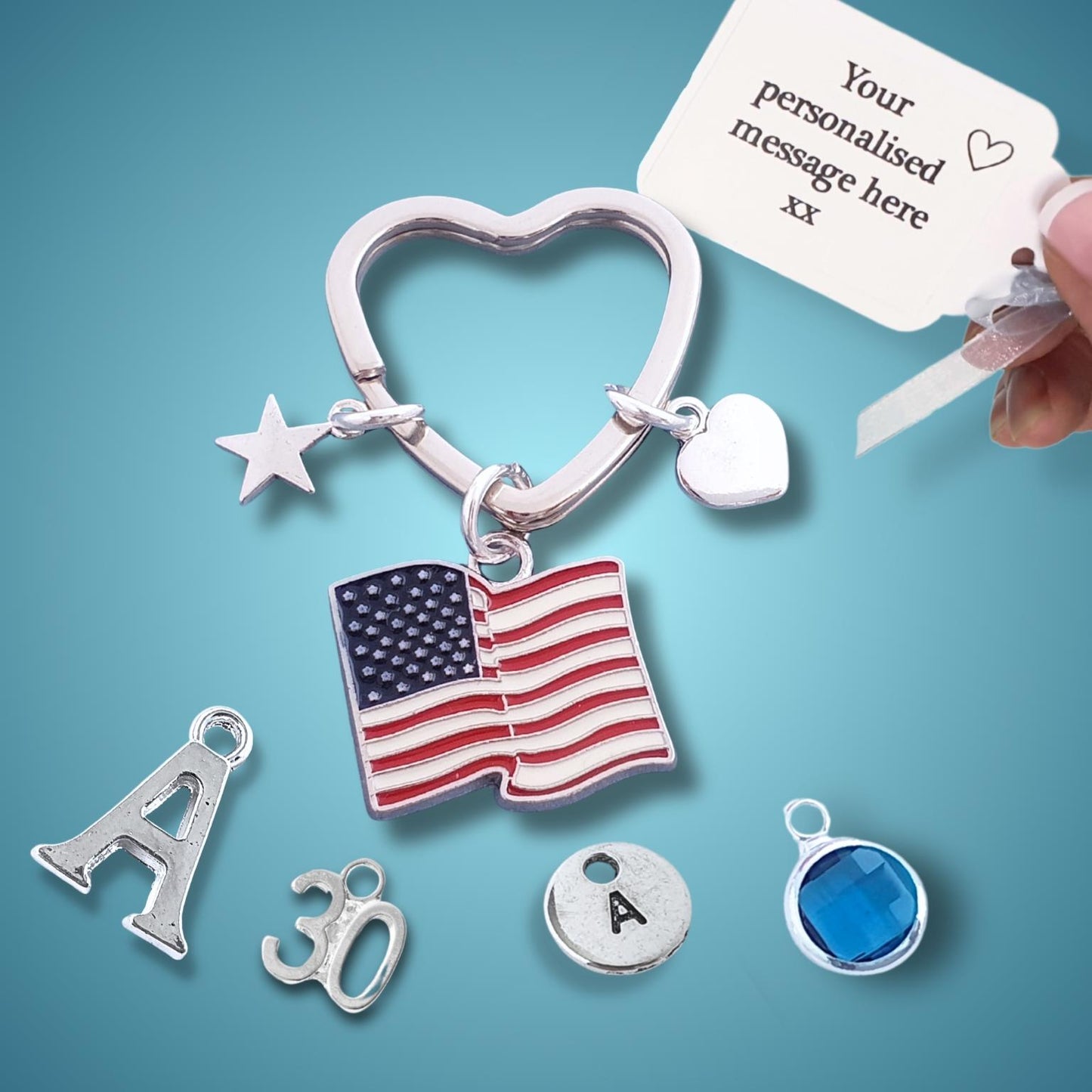 Silver keychain with American flag charm and customizable message card on blue background