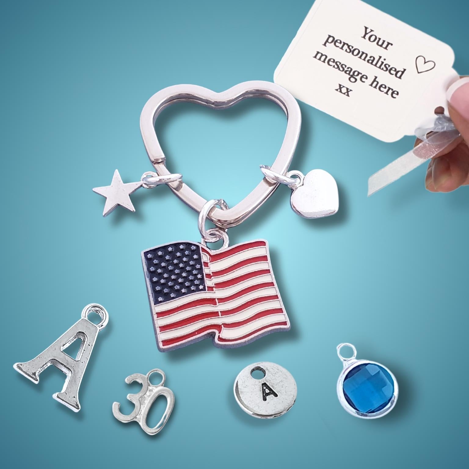 Silver keychain with American flag charm and customizable message card on blue background