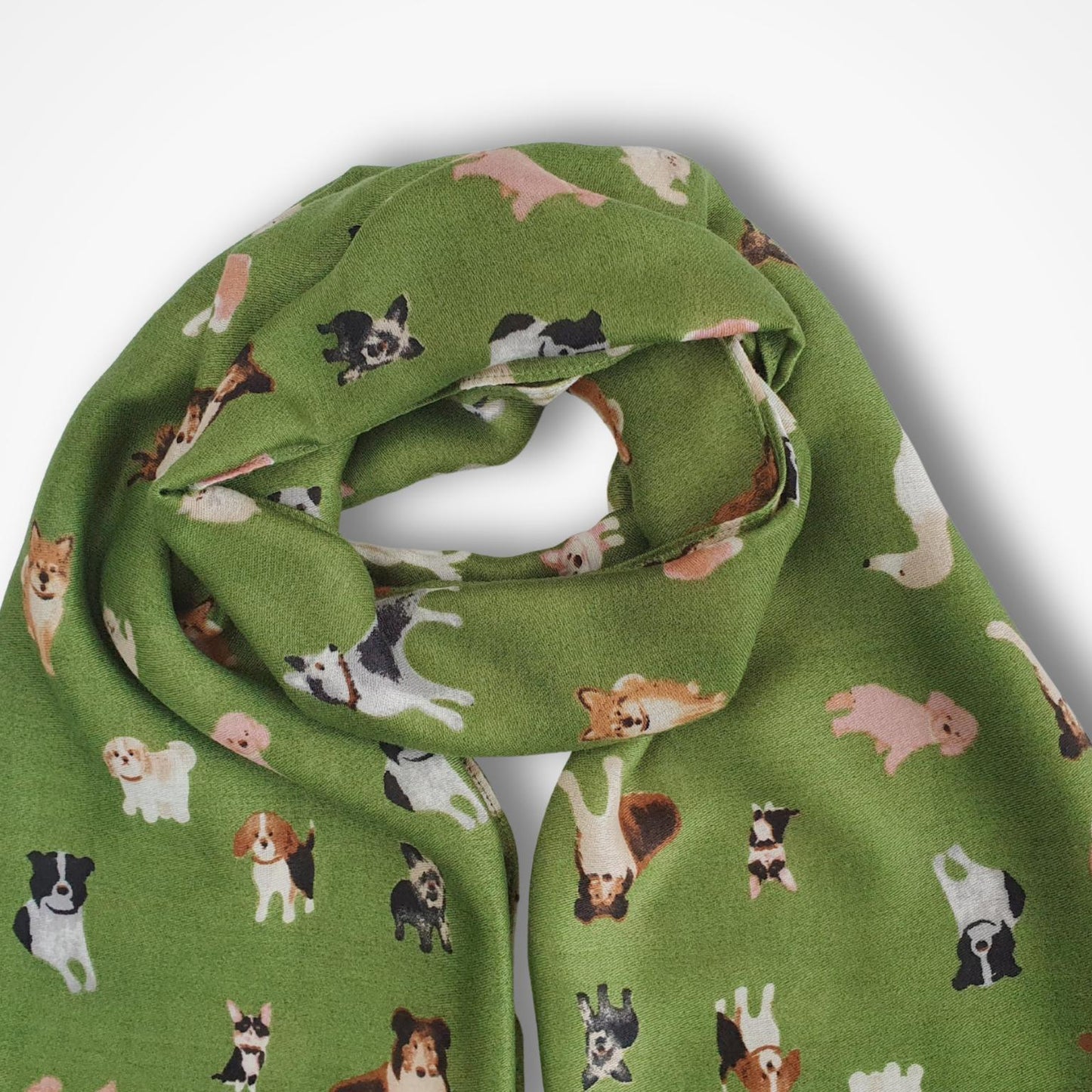 Green scarf with dog pattern on a white background