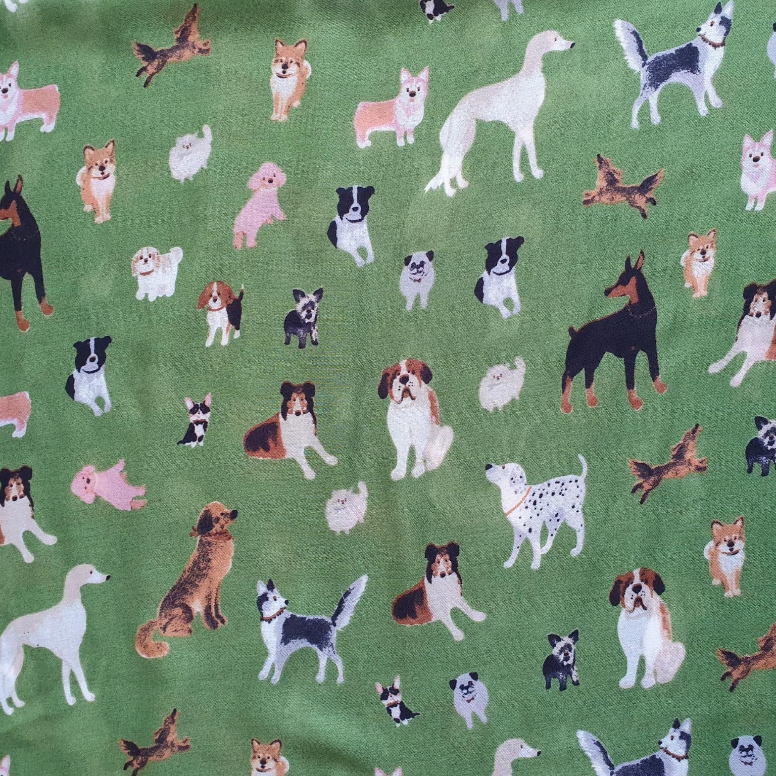 Pattern of various dog illustrations on a green background