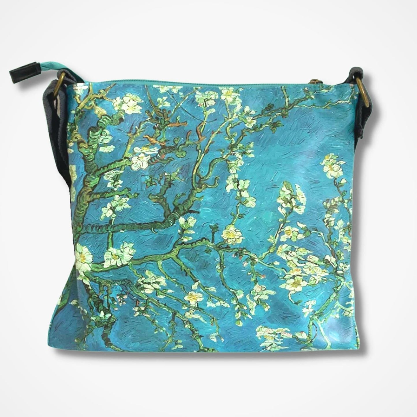 A square crossbody bag featuring a print of Van Gogh's 'Almond Blossom' painting, with a vibrant turquoise blue background, white blossoms, and green branches. It has black straps and is shown against a plain white background.