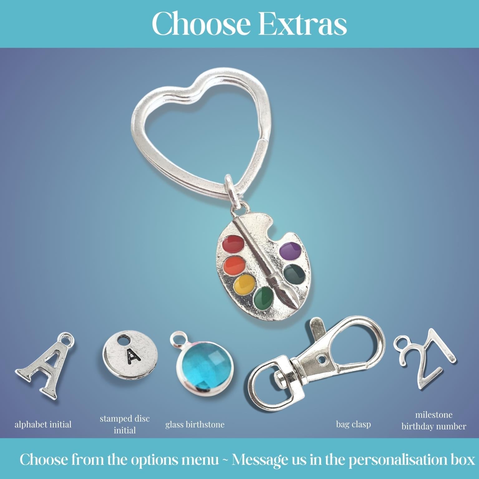 Set of customizable charms with a heart-shaped keychain on a gradient blue background.