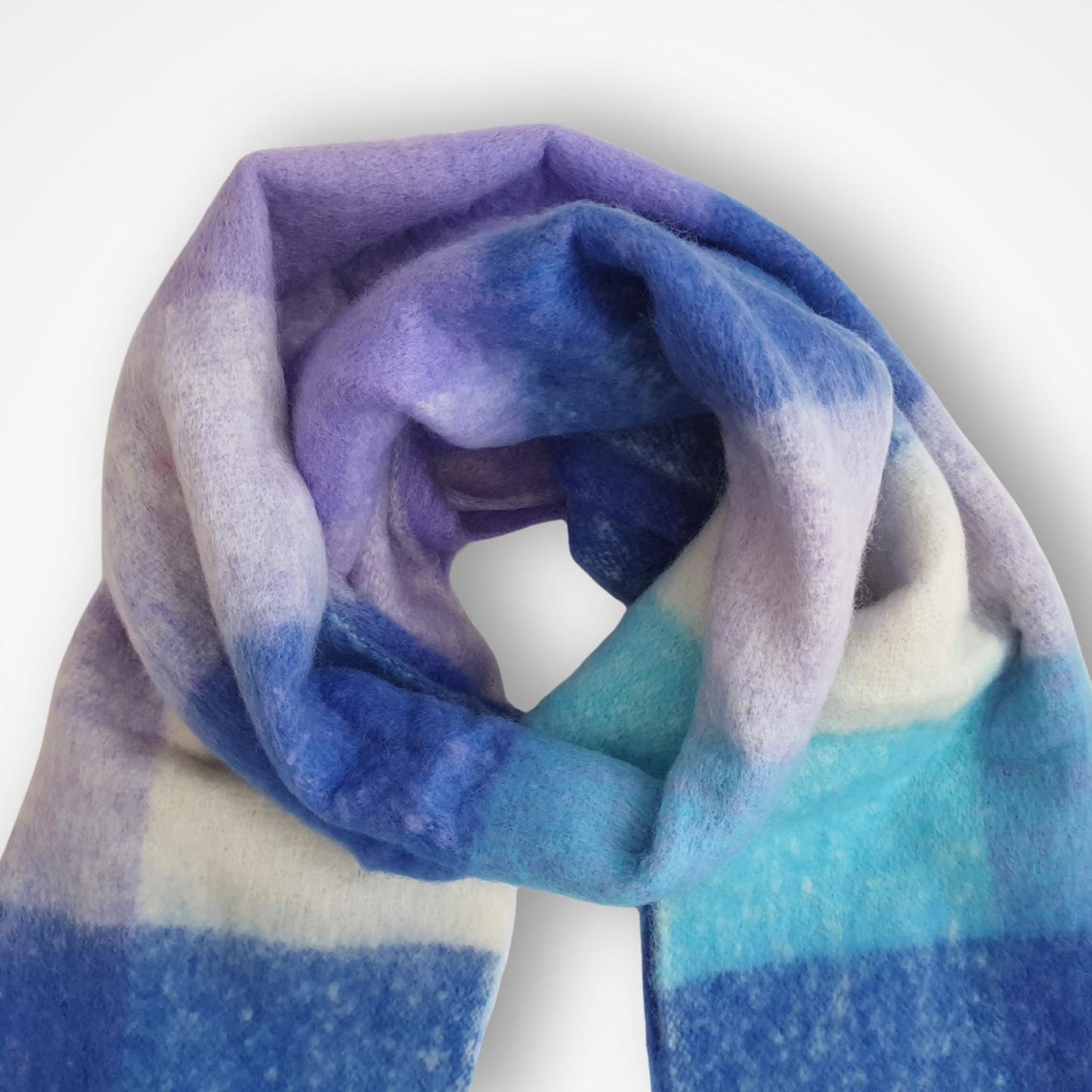 Gradient scarf transitioning from purple to blue on a white background