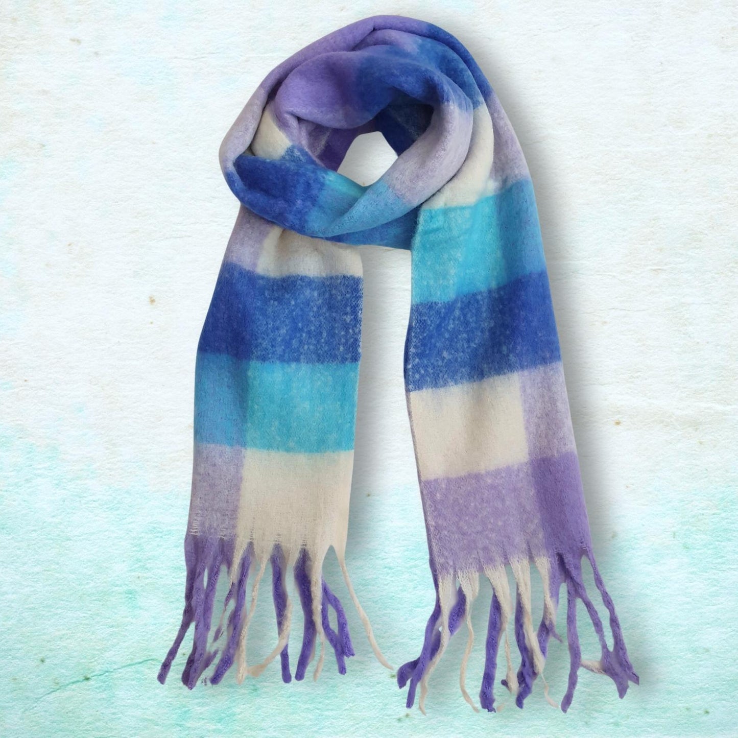 checked scarf with purple, blue, and white on a light textured background