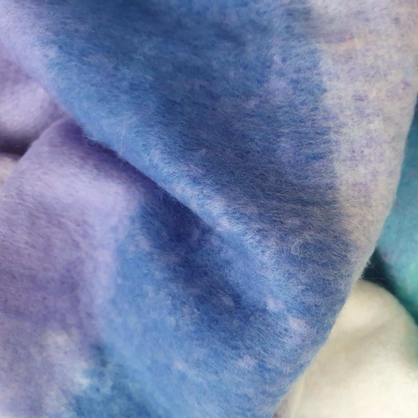 Close-up of scarf fabric with blue and purple hues