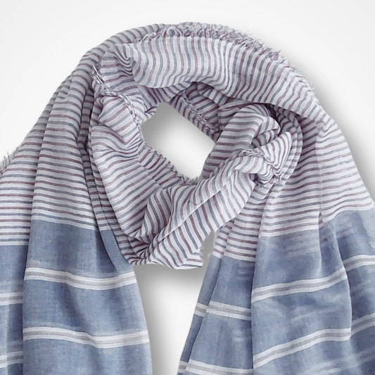 Striped scarf with blue and white colors on a light gray background