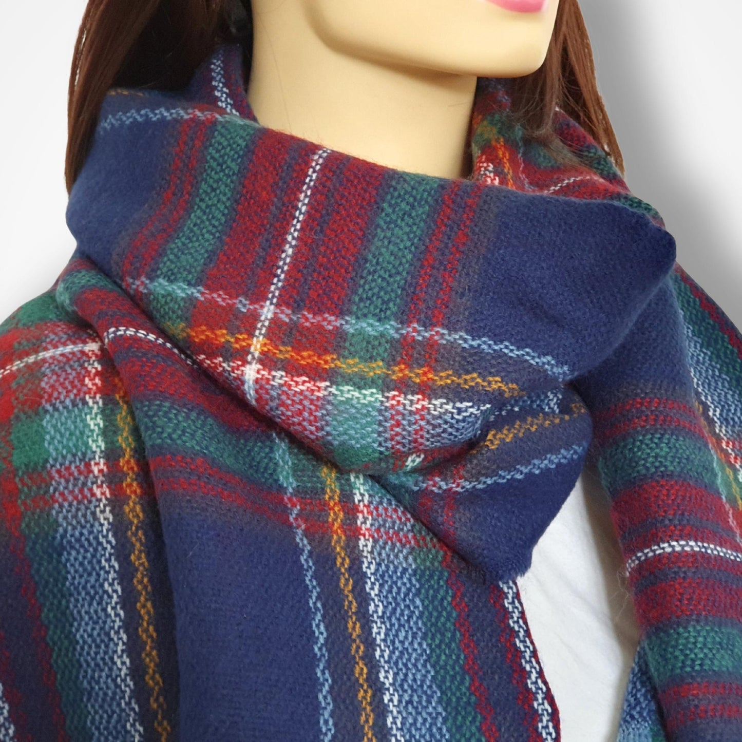 Plaid scarf worn by a mannequin on a white background
