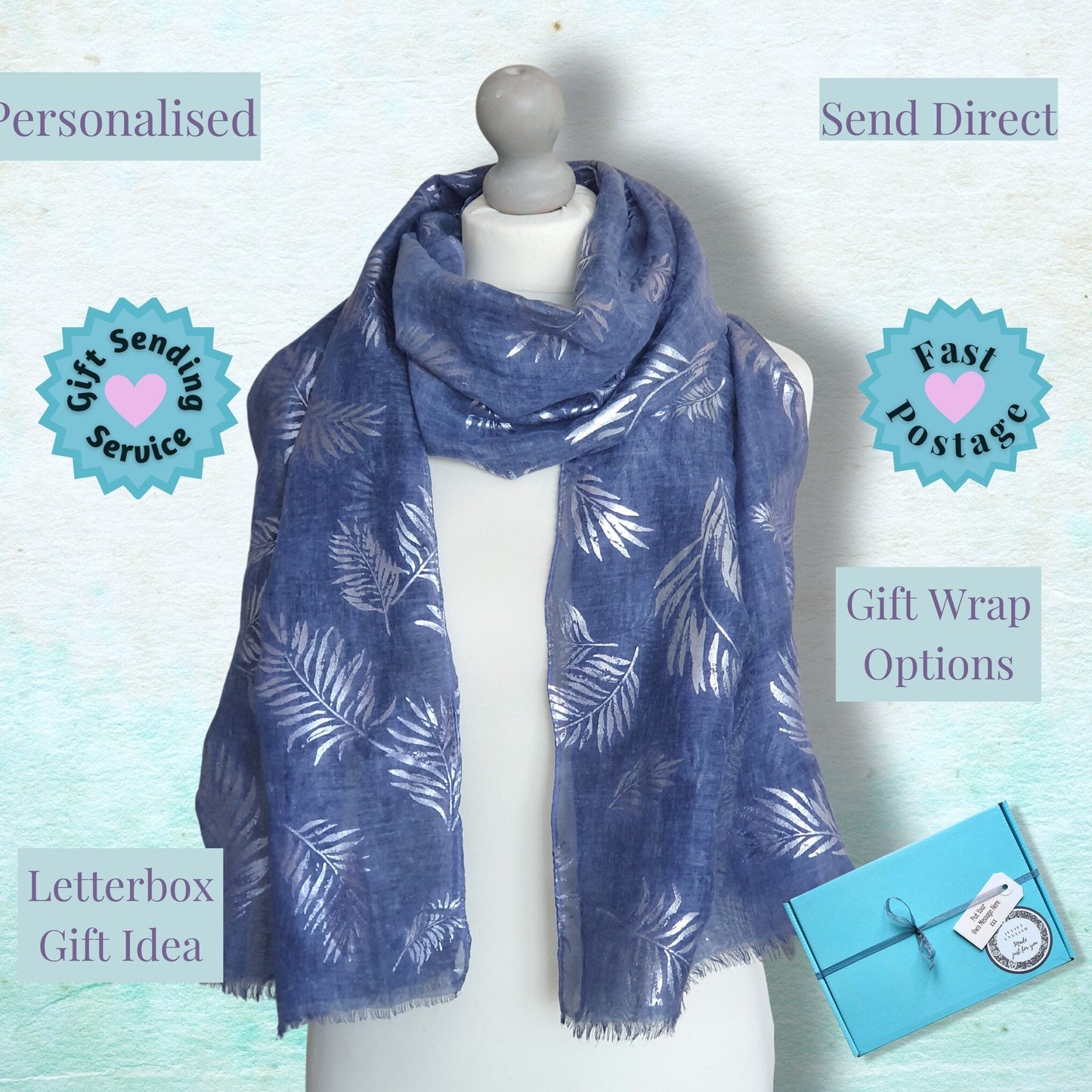 A blue scarf with a white leaf pattern is displayed on a white mannequin torso. The background is a textured light blue-green surface with several promotional text overlays and badges reading 'Personalised', 'Send Direct', 'Gift Sending Service', 'Fast Postage', 'Gift Wrap Options', and 'Letterbox Gift Idea'.