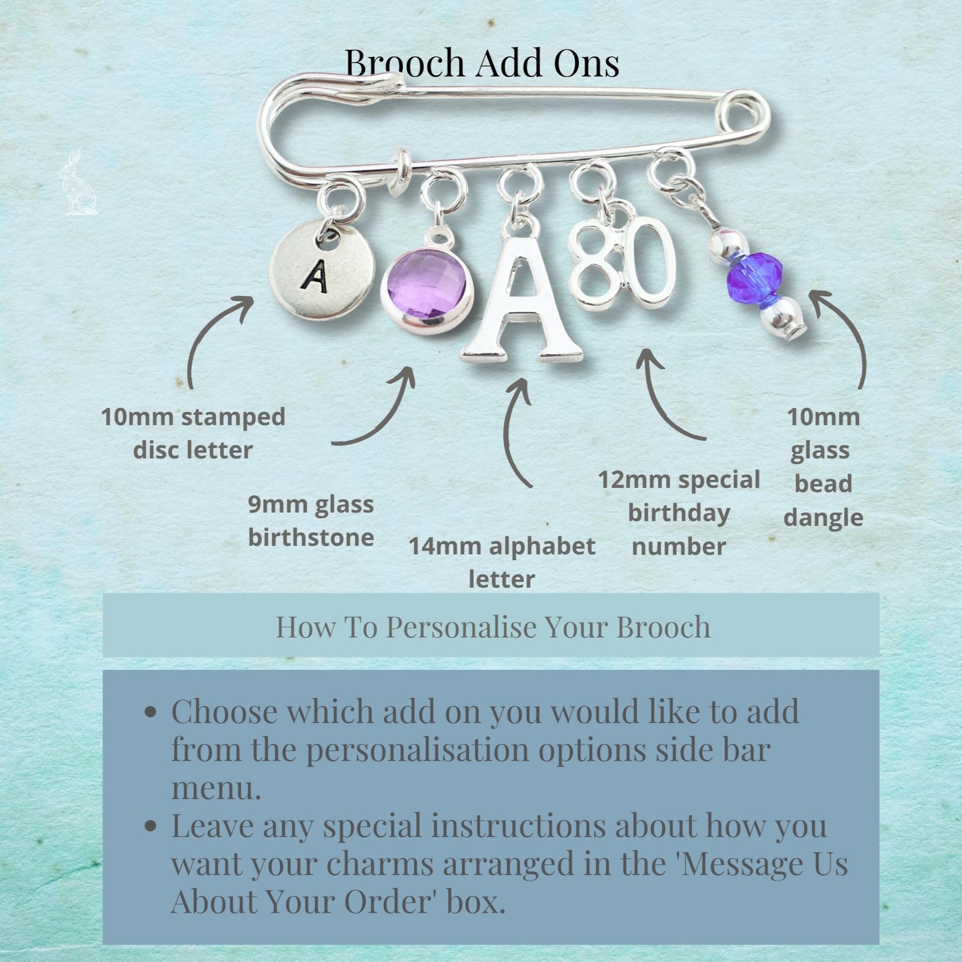 Brooch with customizable add-ons on a light blue background