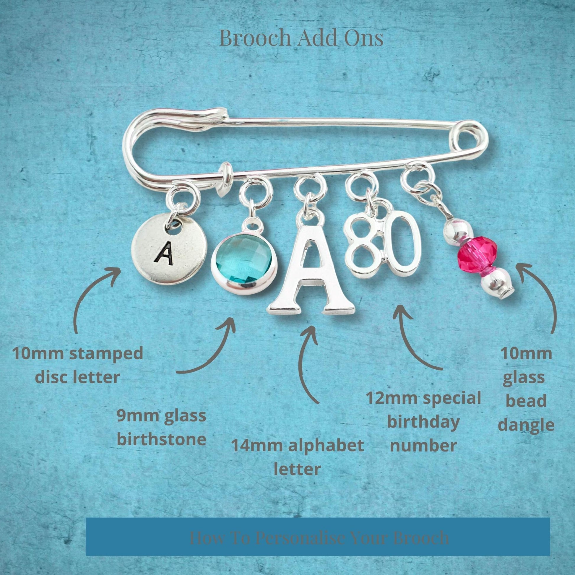 Brooch with customizable add-ons on a textured blue background