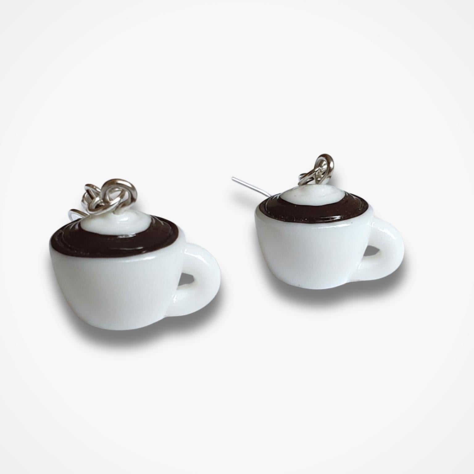 White coffee cup earrings with brown accents on a white background
