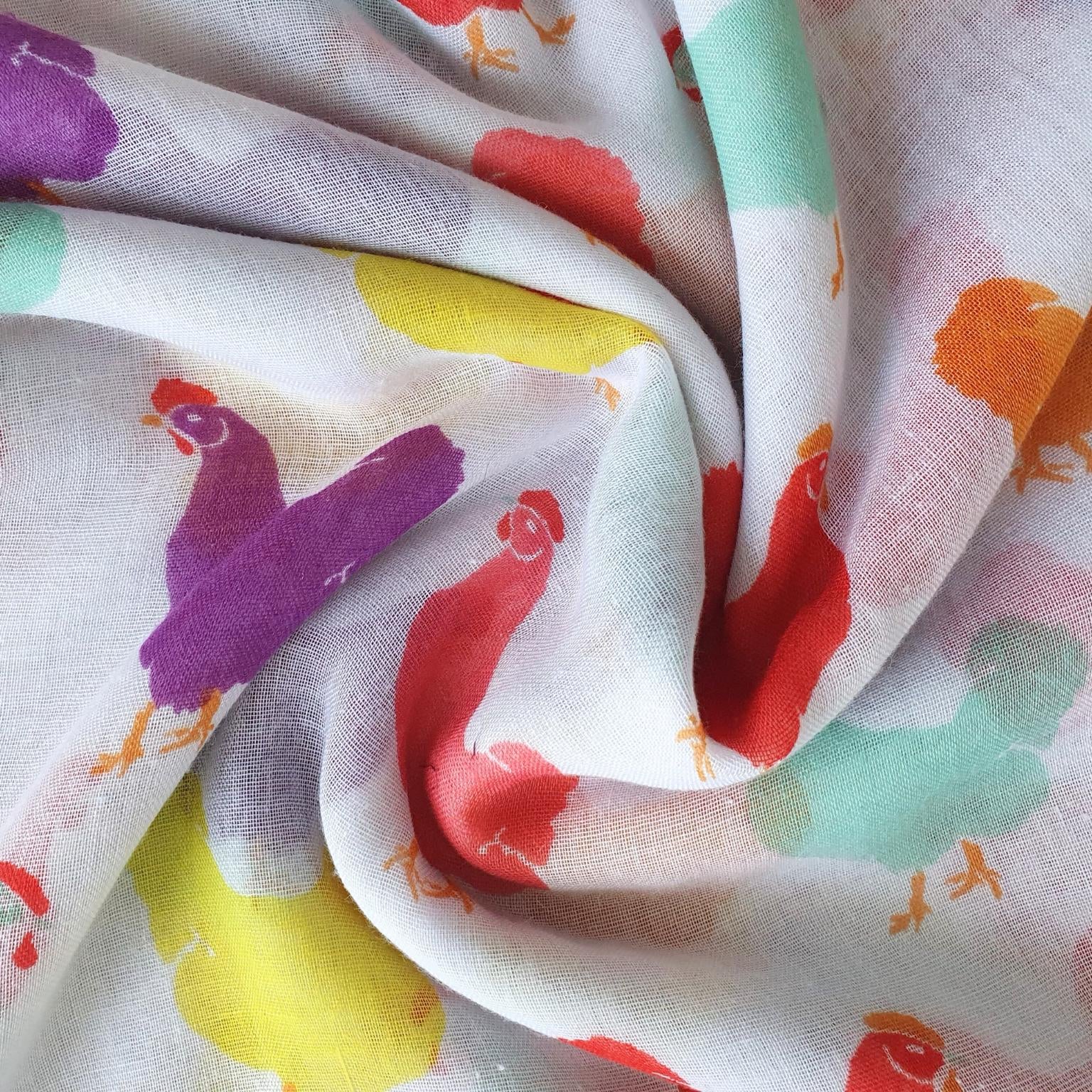 Colorful fabric with chicken patterns on a white background