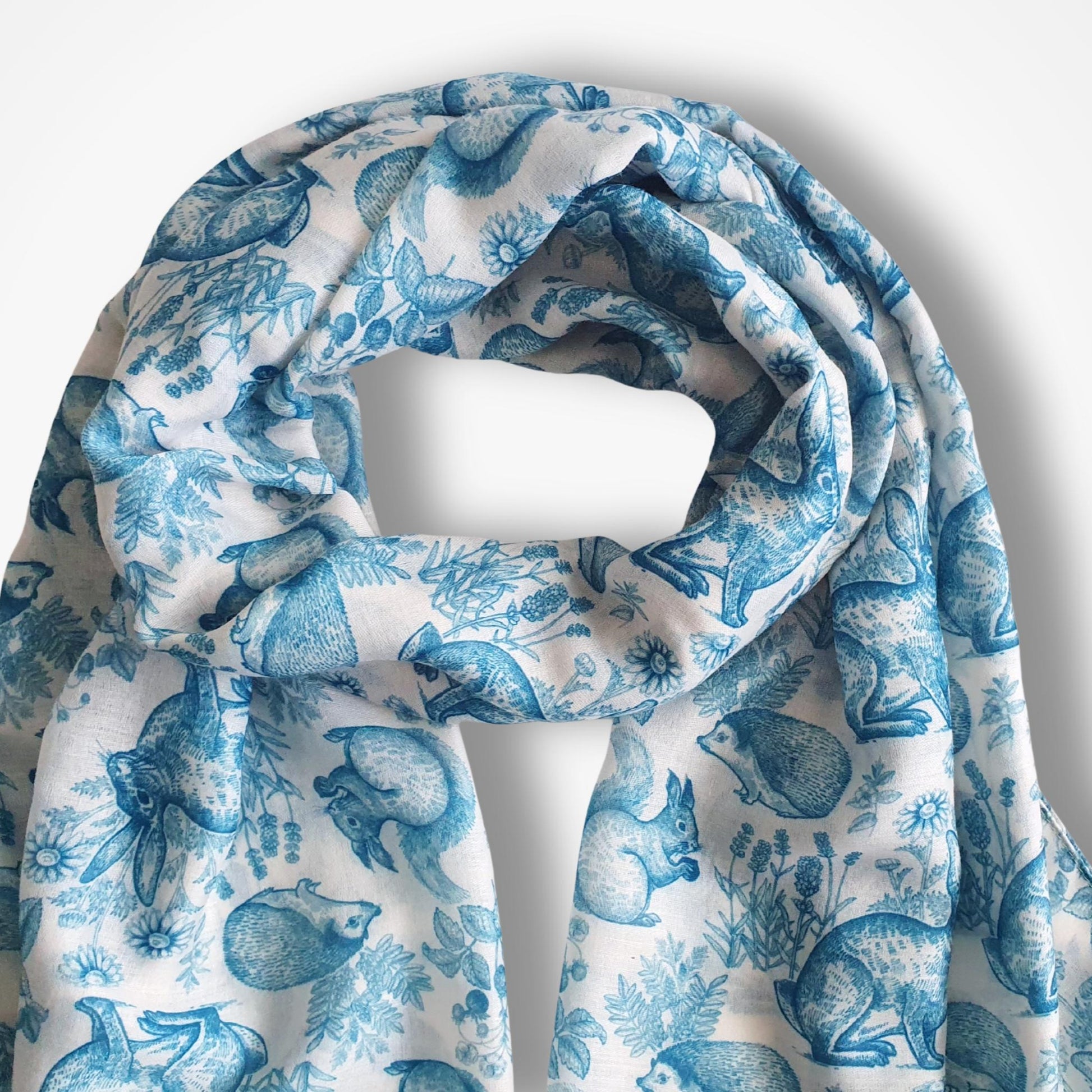 Blue and white patterned scarf on a white background