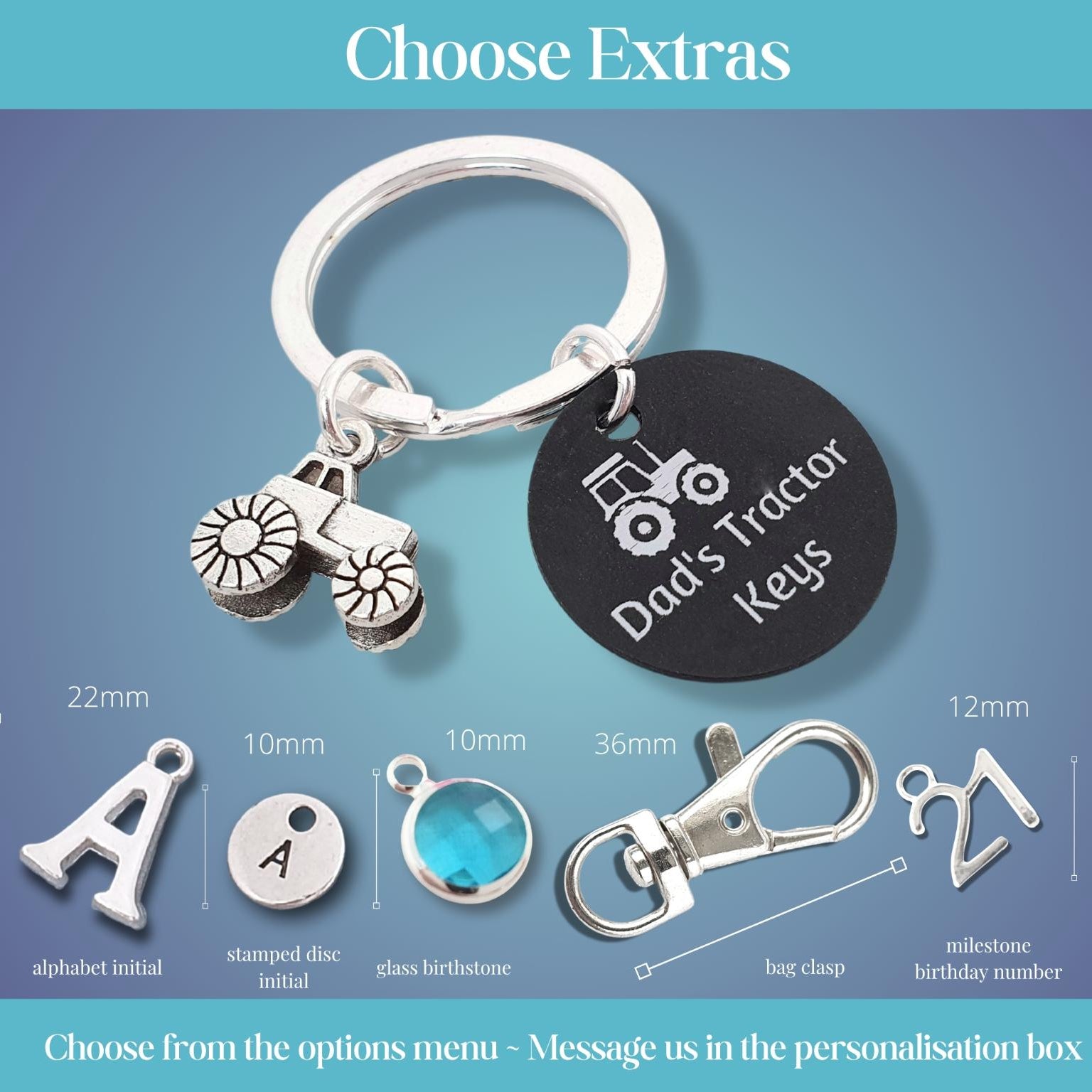 Personalised silver keychain with a tractor charm, a black round tag engraved with 'Dad's Tractor Keys', and an extra keyring shown under the heading 'Choose Extras' on a blue gradient background with size and customization options illustrated below.