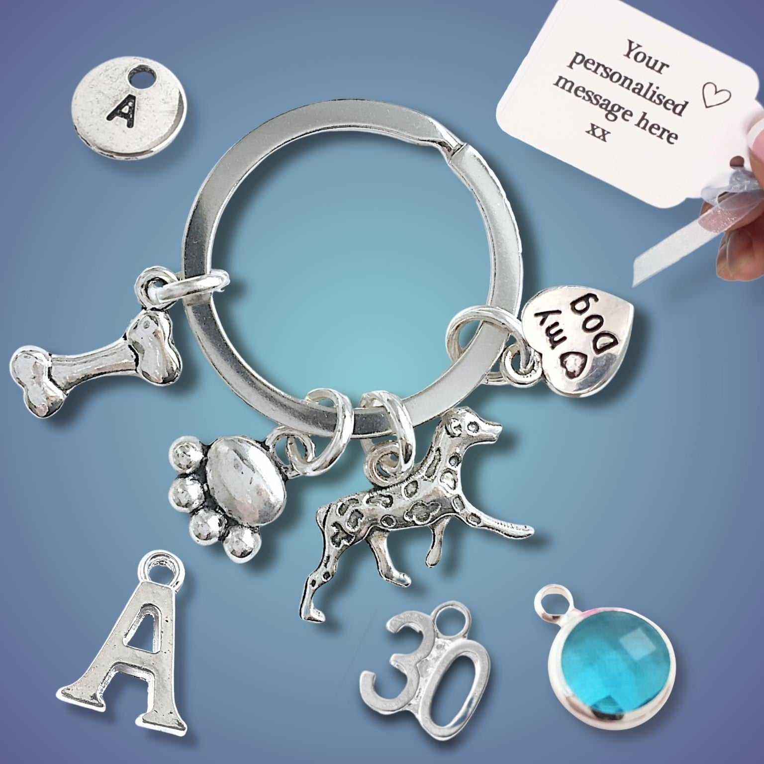 Silver keychain with various charms on a blue background