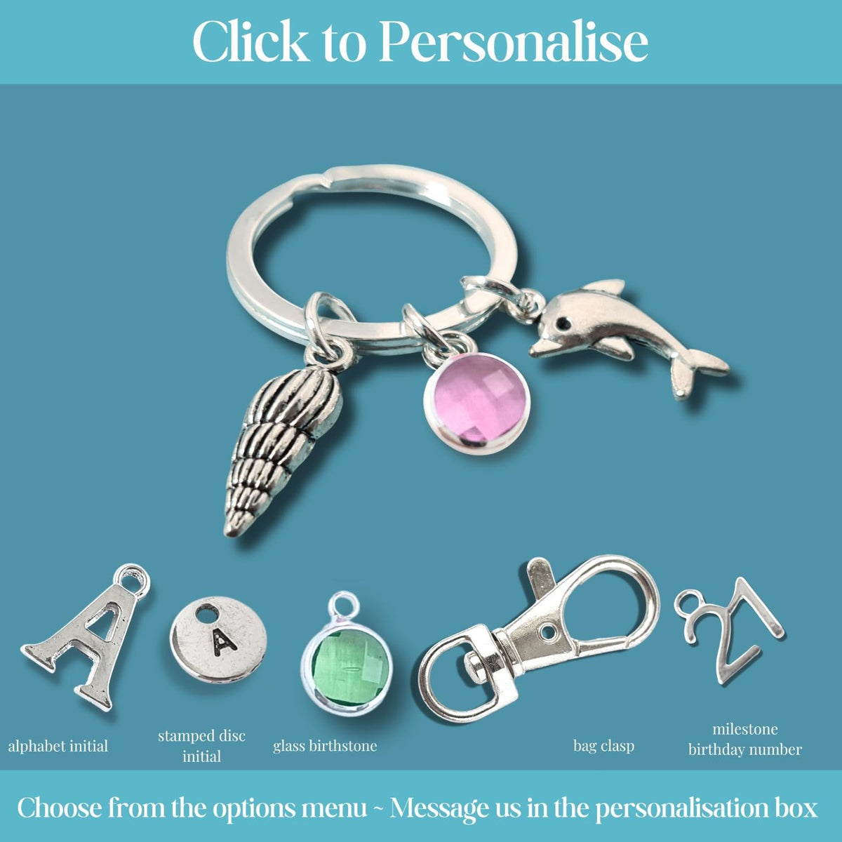 A silver keychain with charms including a seashell, dolphin, and pink oval stone, shown on a teal background with text options for personalization such as alphabet initial, stamped disc initial, glass birthstone, bag charm, and milestone birthday number.