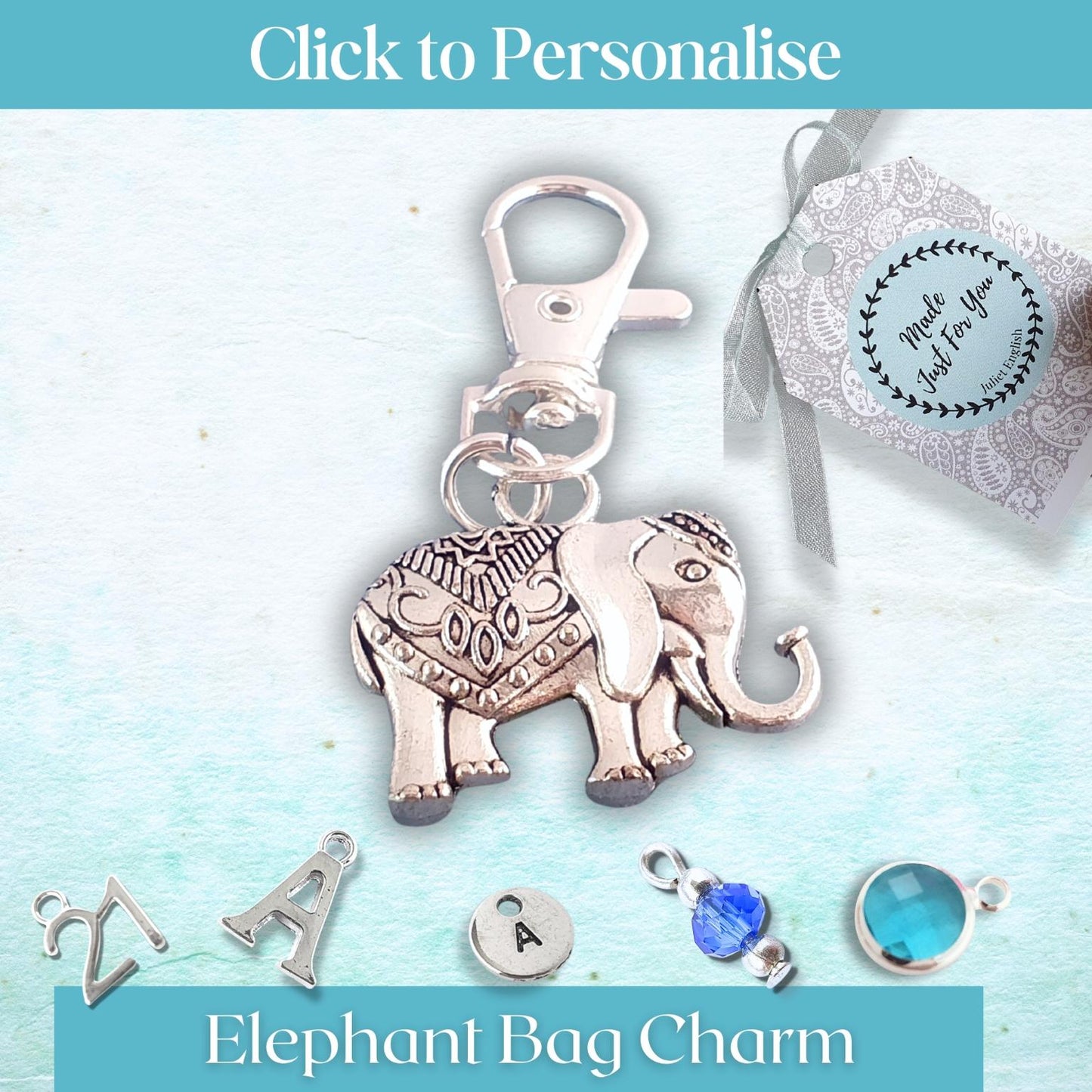 Silver elephant bag charm with customizable options on a light blue background