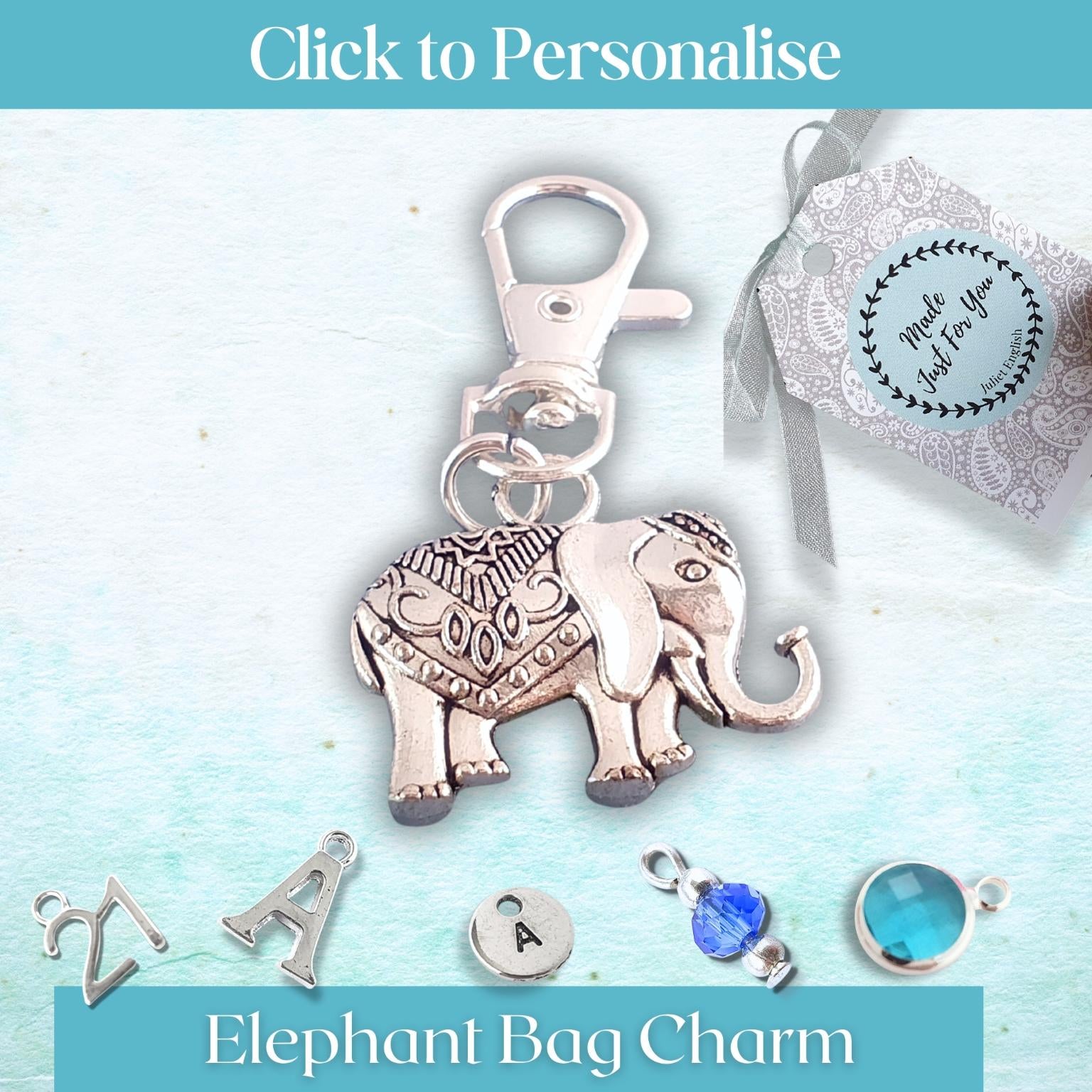 Silver elephant bag charm with customizable options on a light blue background