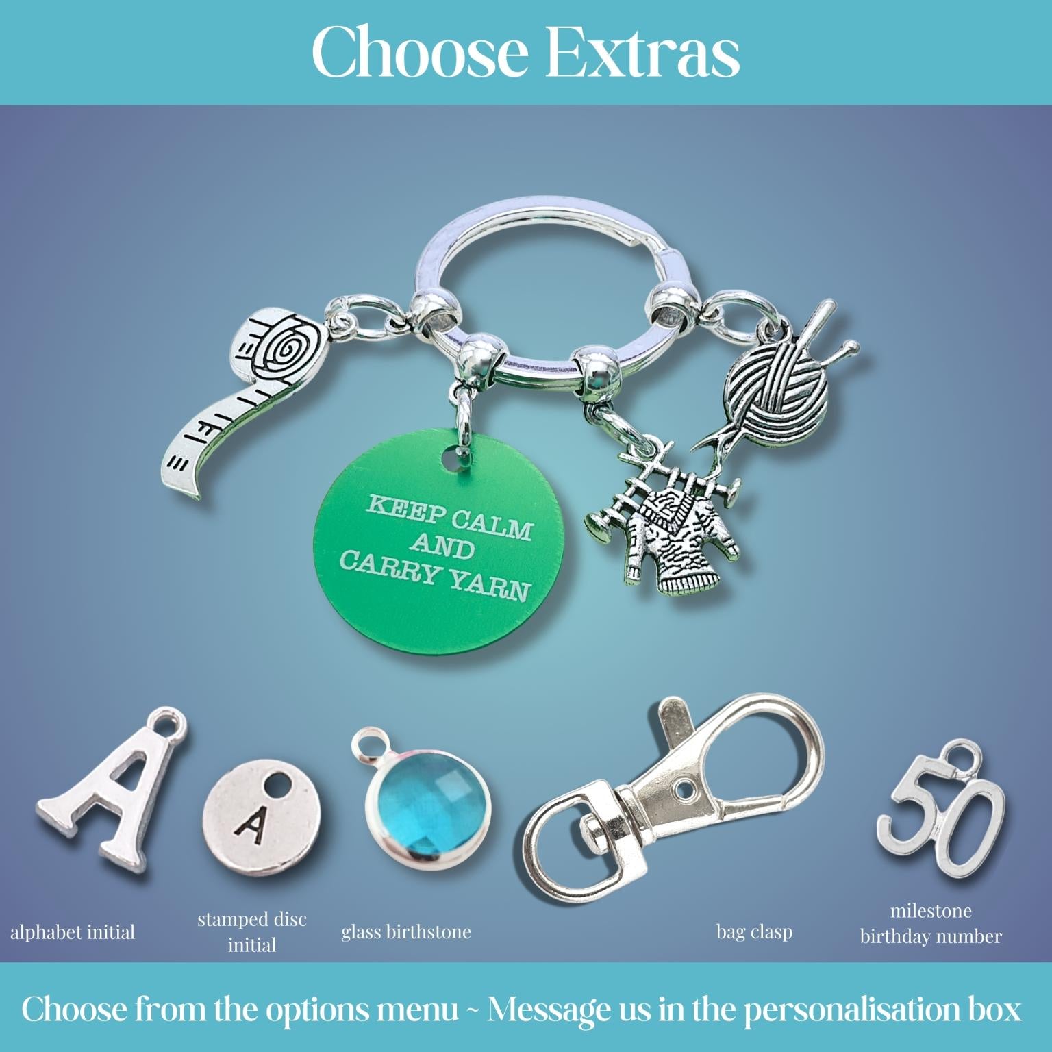 A product customization graphic showing a silver keyring with charms, including a green round charm that reads 'KEEP CALM AND CARRY YARN,' plus separate example charms labeled for personalization such as alphabet initial, stamped disc initial, glass birthstone, bag charm, and milestone birthday number, under the heading 'Choose Extras.'.