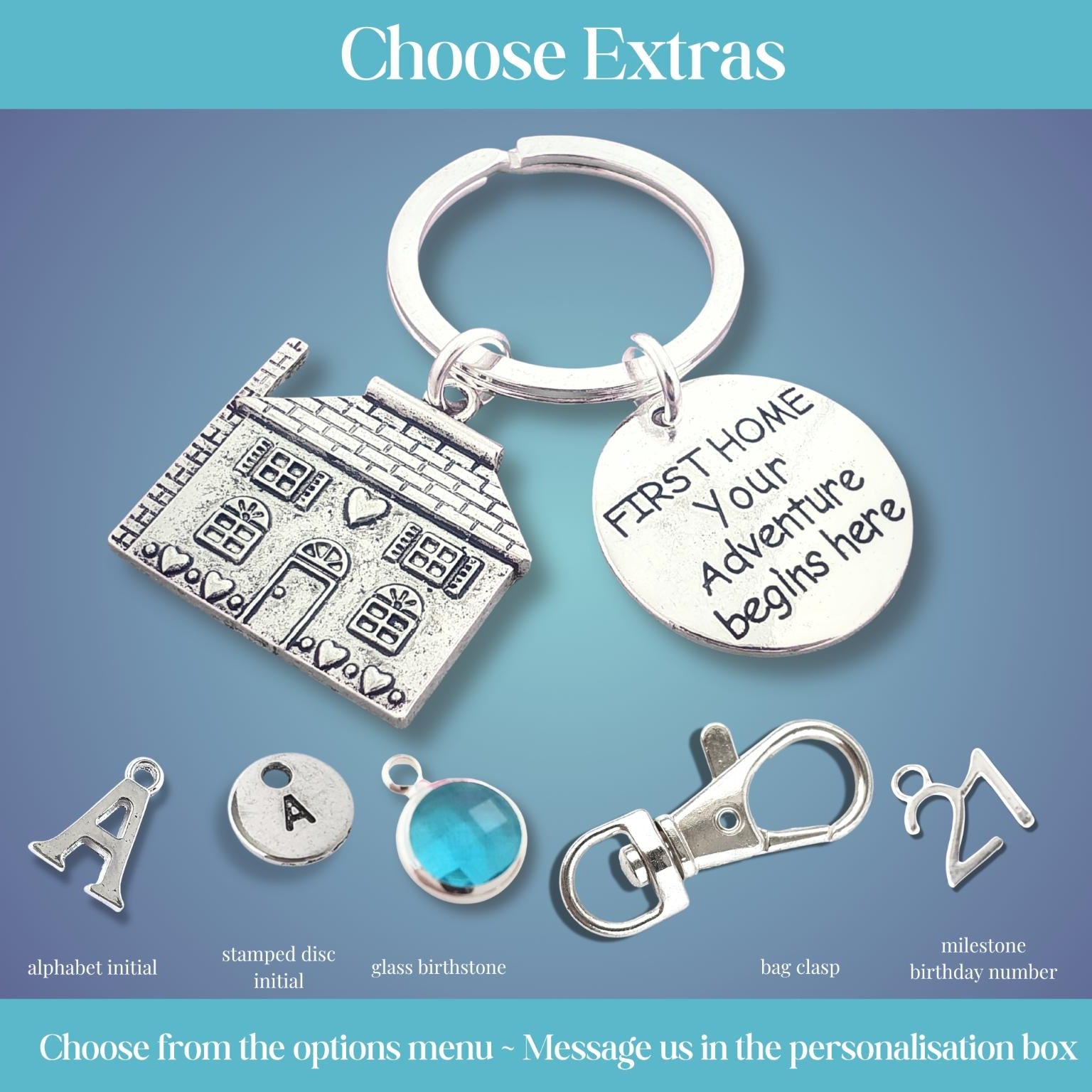 Silver keychain with house charm and 'First Home Your Adventure Begins Here' tag on a blue gradient background.