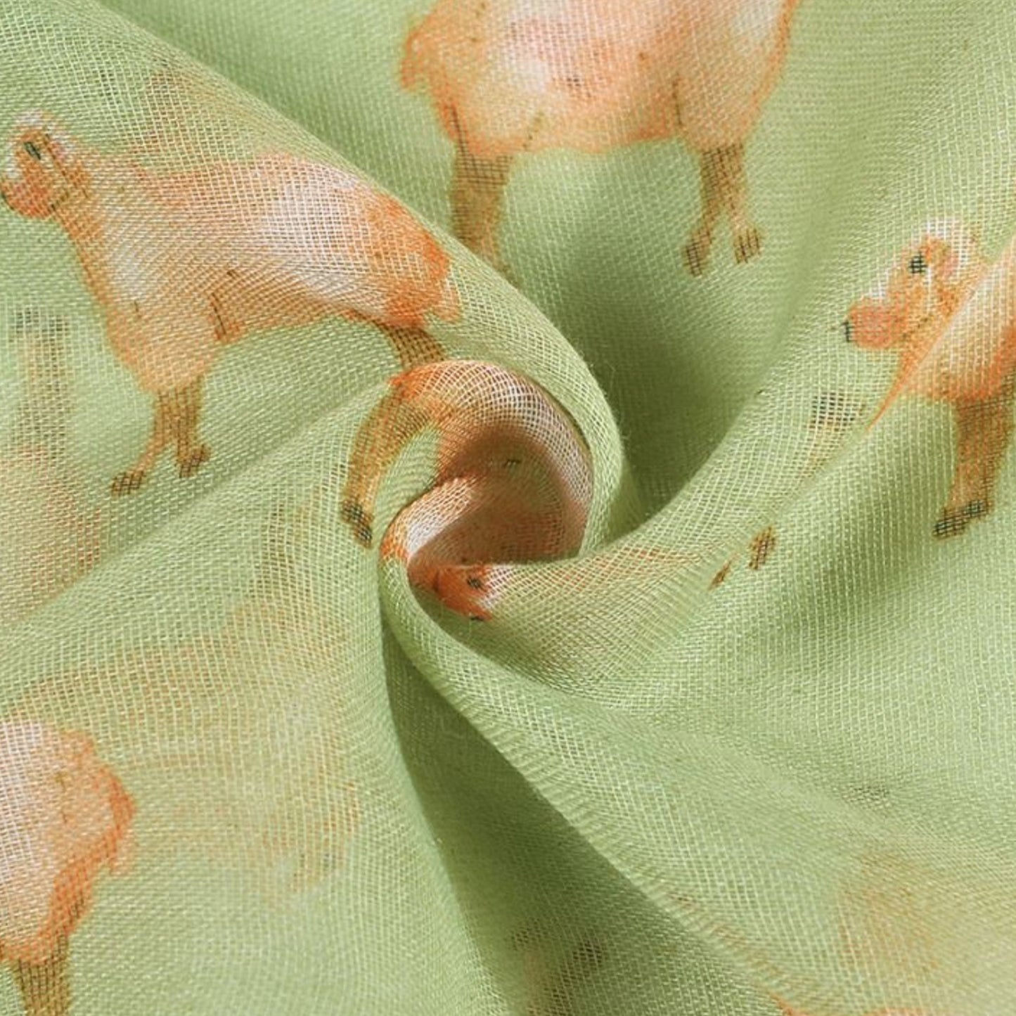 Fabric with sheep pattern on a green background