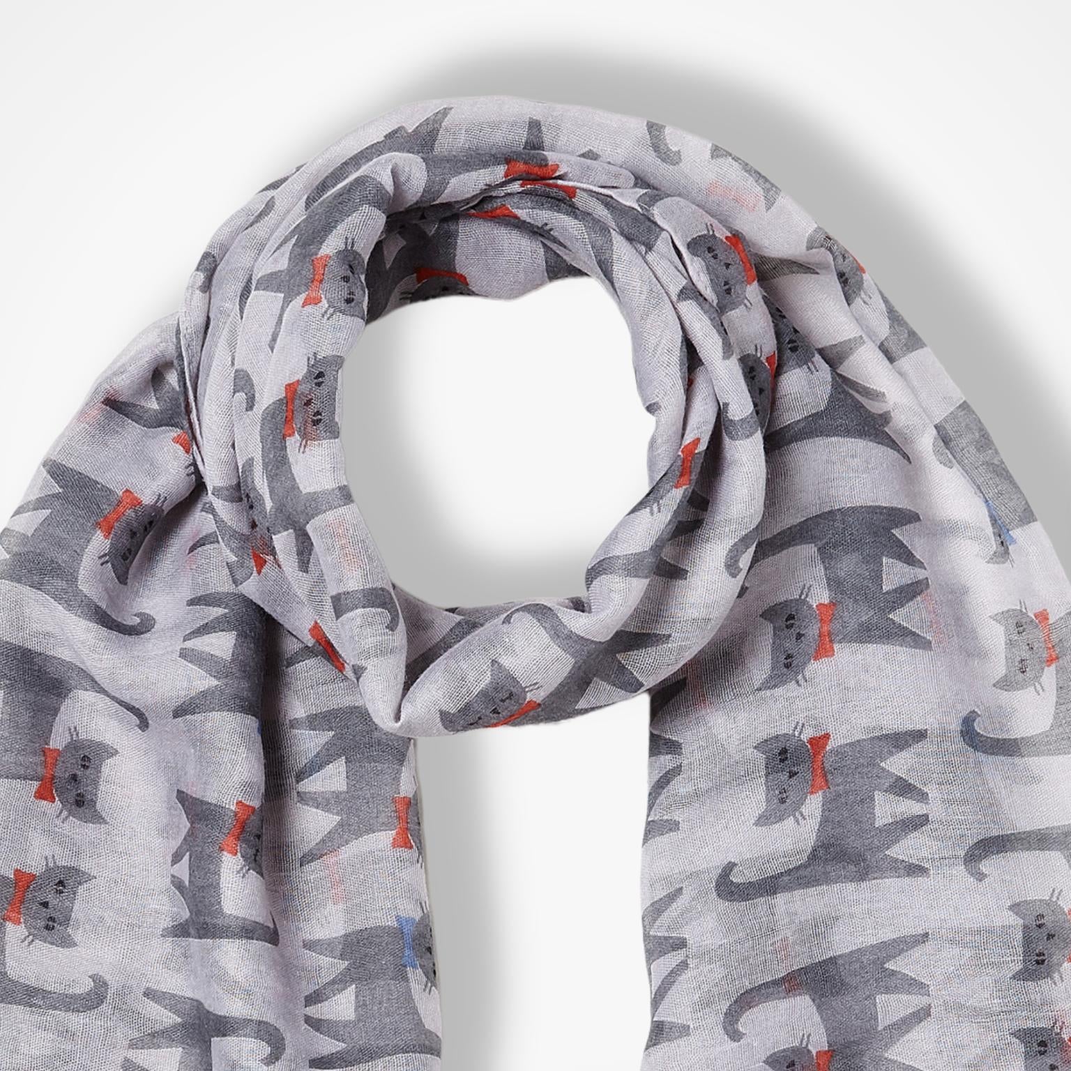 A lightweight grey scarf with an all-over print of stylized grey cats wearing small red and blue bow ties, displayed on a clean white background.